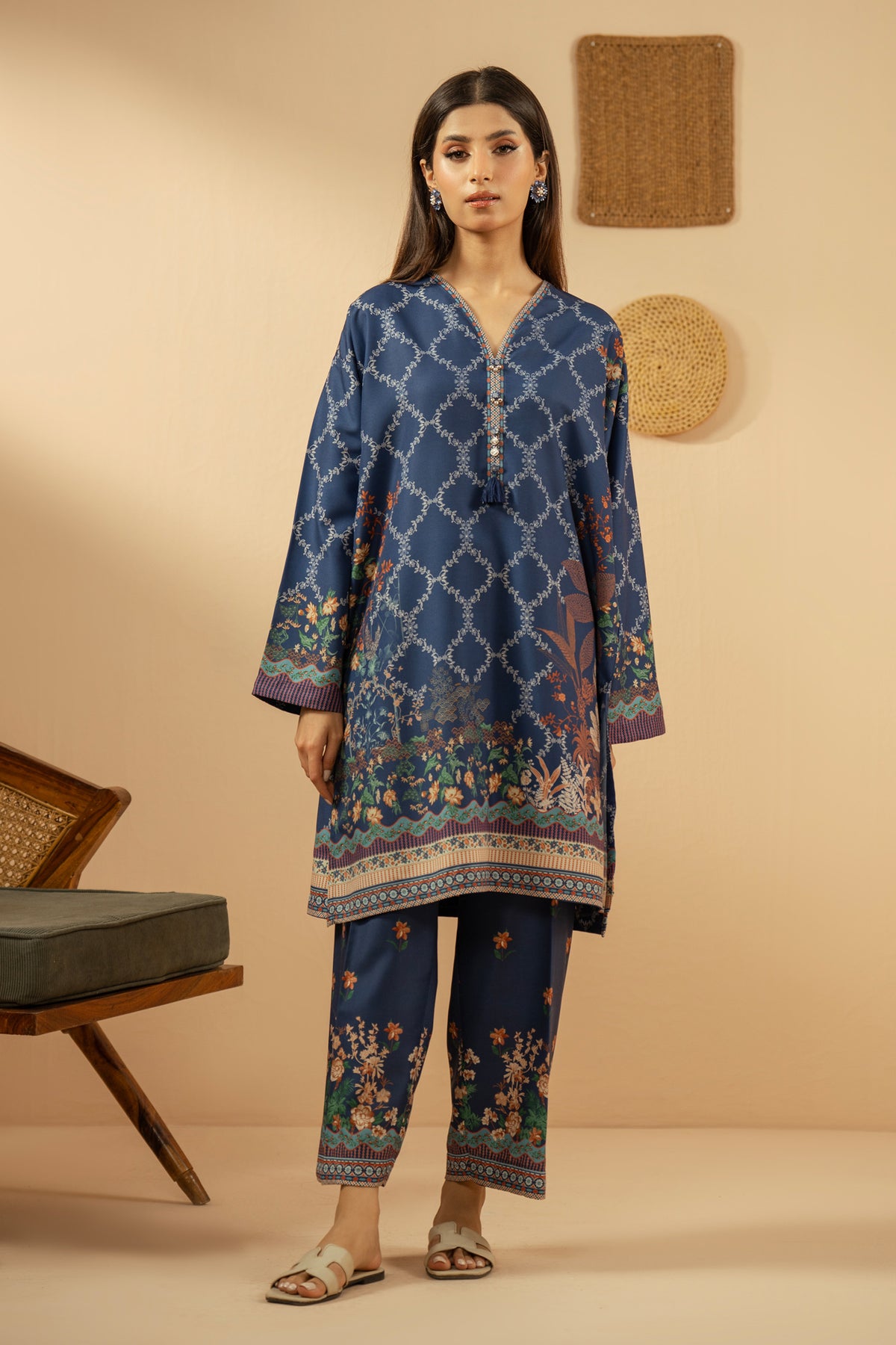 Casual stitched 2-piece blue poly cambric suit highlighted by sharp contemporary patterns