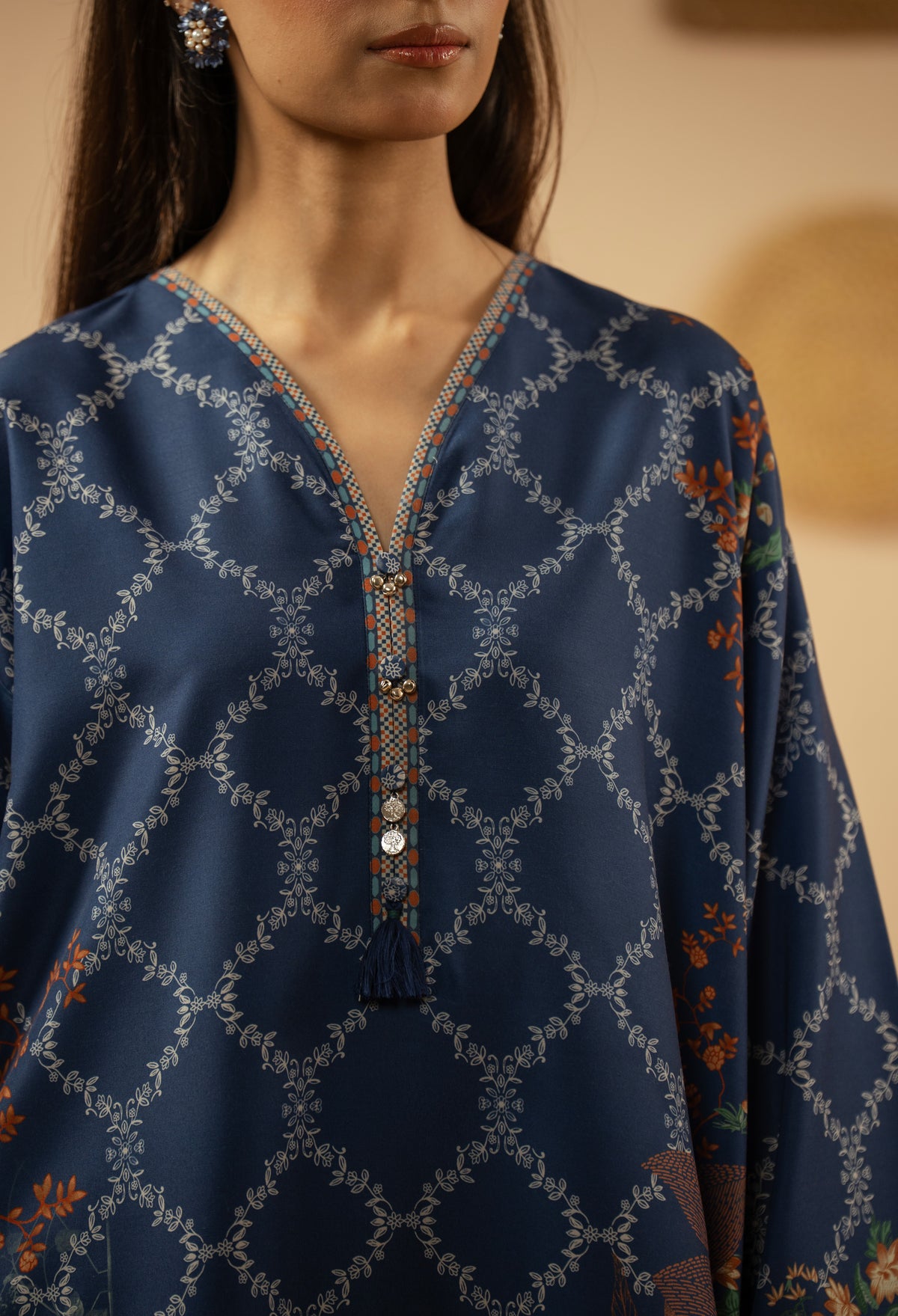 Casual stitched 2-piece blue poly cambric suit highlighted by sharp contemporary patterns
