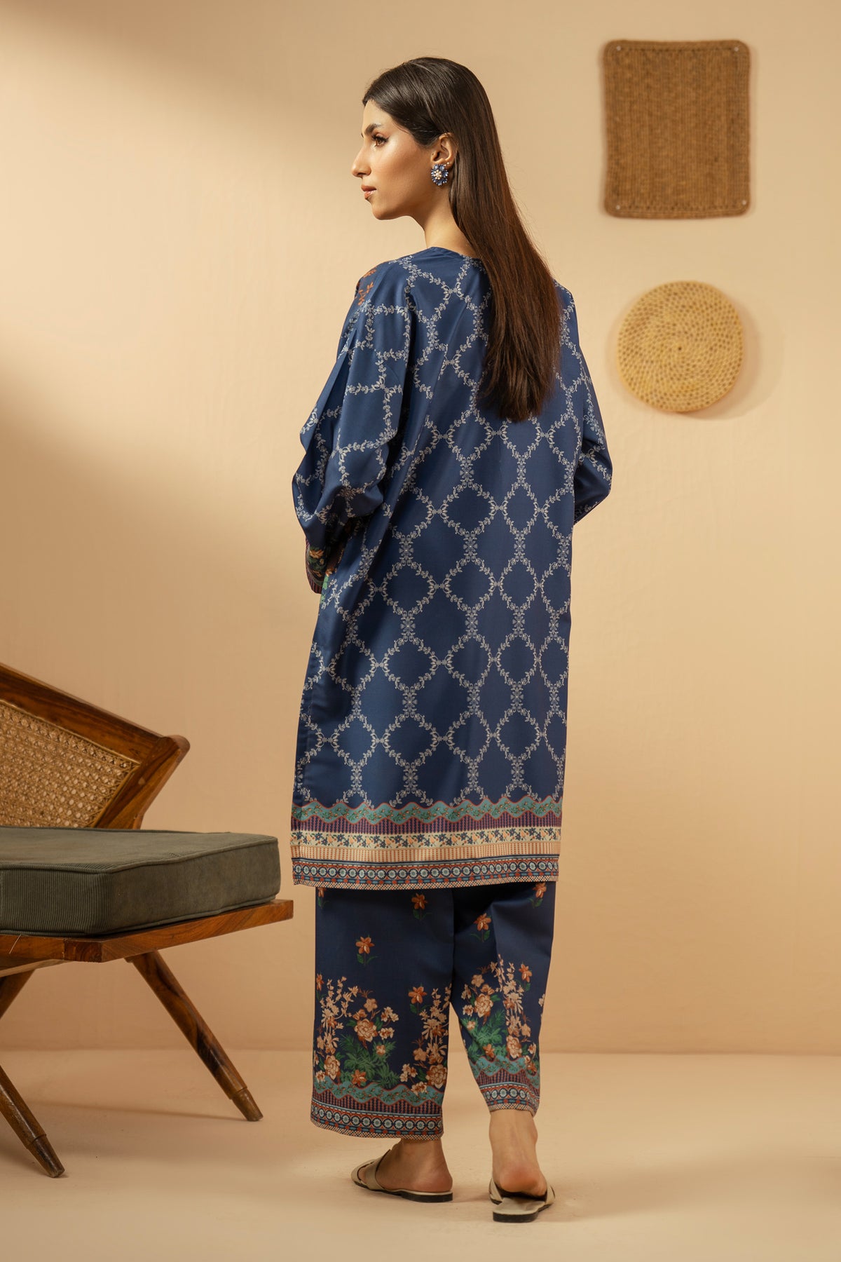 Casual stitched 2-piece blue poly cambric suit highlighted by sharp contemporary patterns