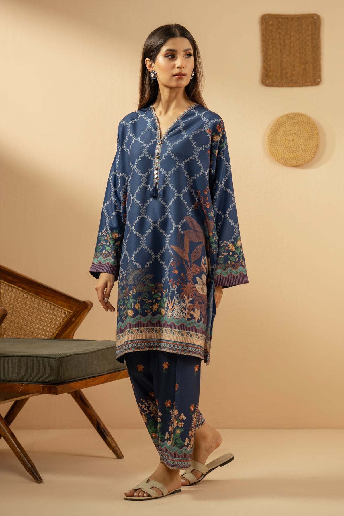 Casual stitched 2-piece blue poly cambric suit highlighted by sharp contemporary patterns