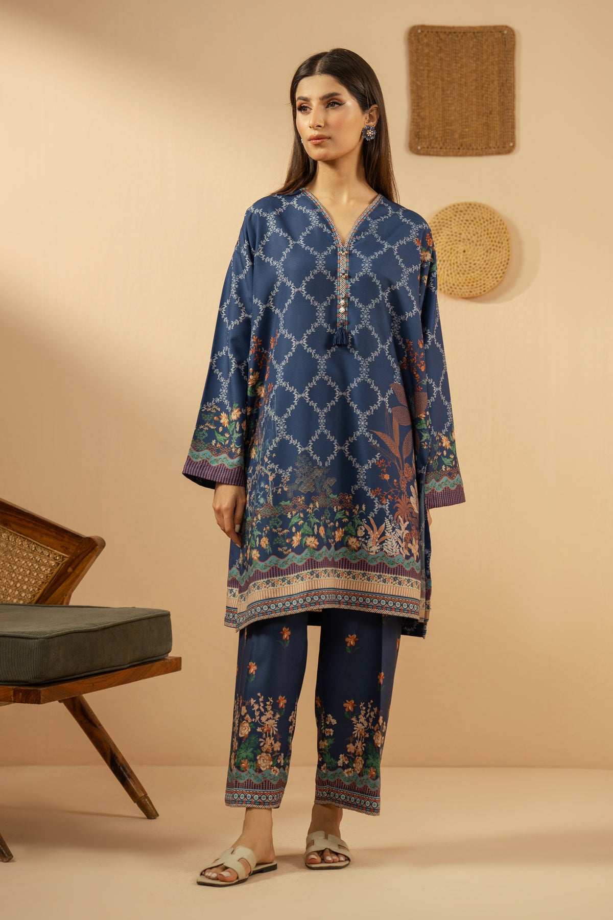 Casual stitched 2-piece blue poly cambric suit highlighted by sharp contemporary patterns