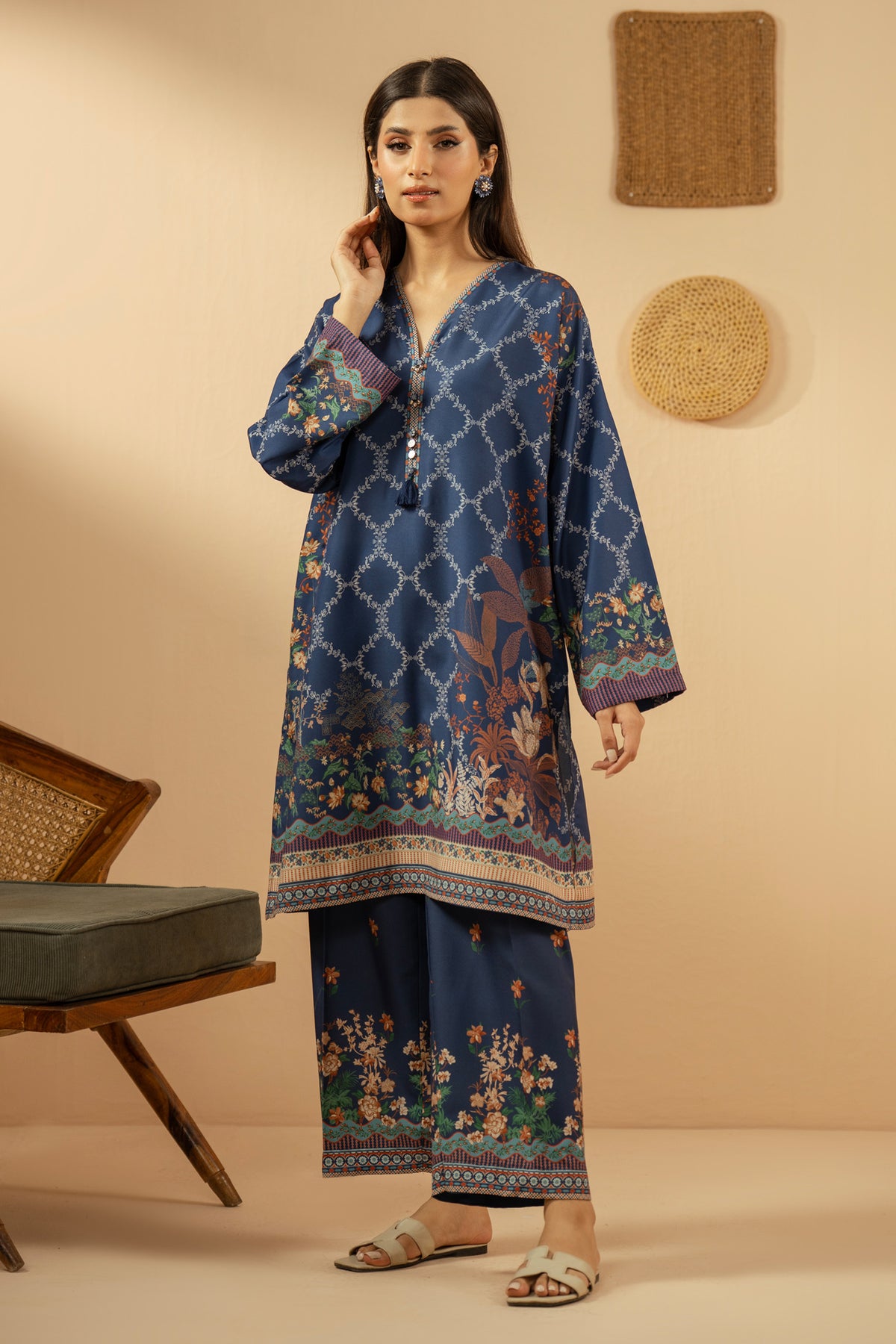 Casual stitched 2-piece blue poly cambric suit highlighted by sharp contemporary patterns