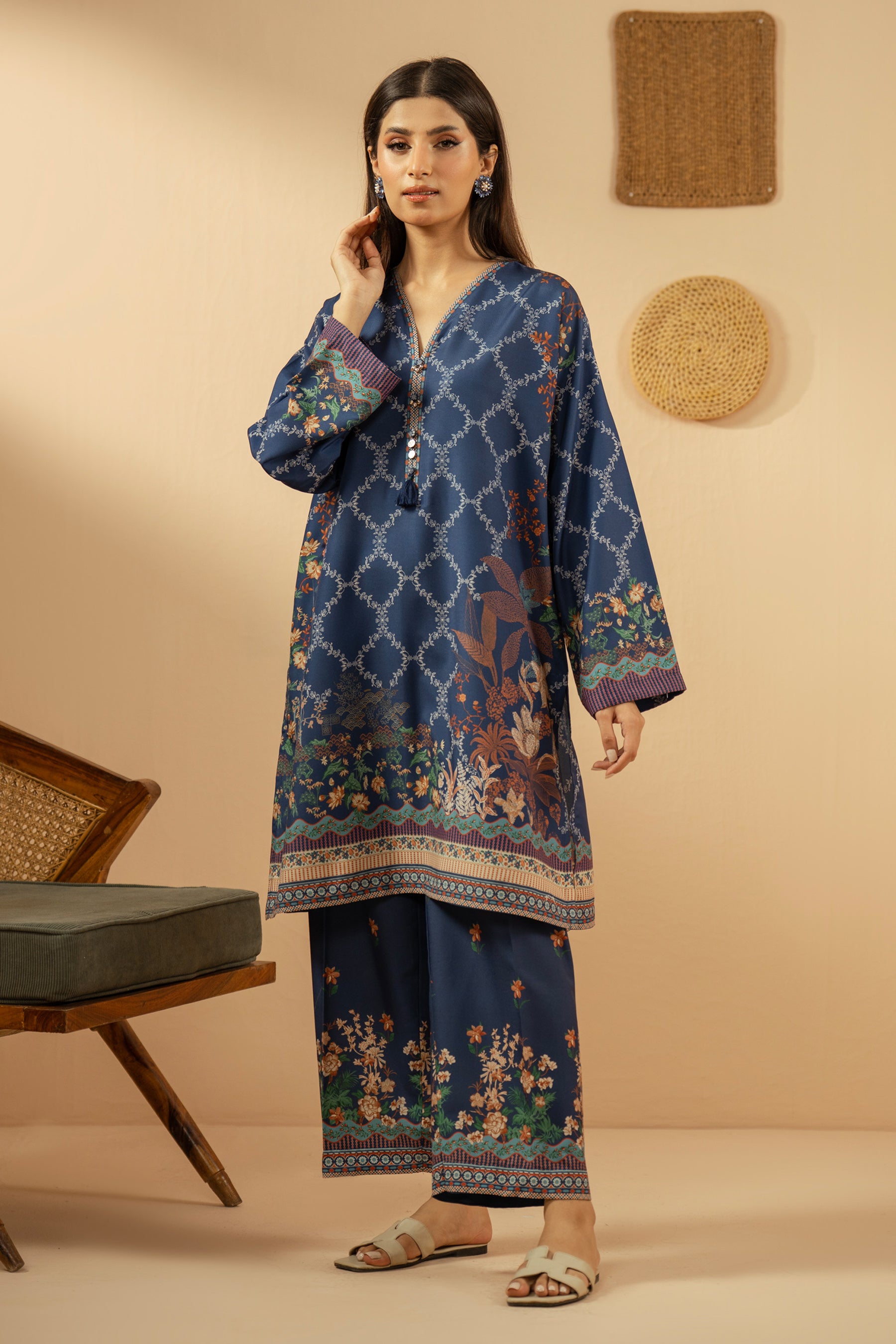 Casual stitched 2-piece blue poly cambric suit highlighted by sharp contemporary patterns