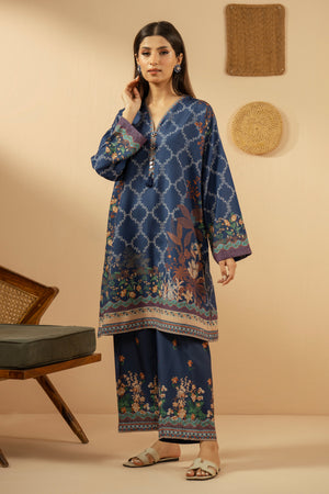 Casual stitched 2-piece blue poly cambric suit highlighted by sharp contemporary patterns