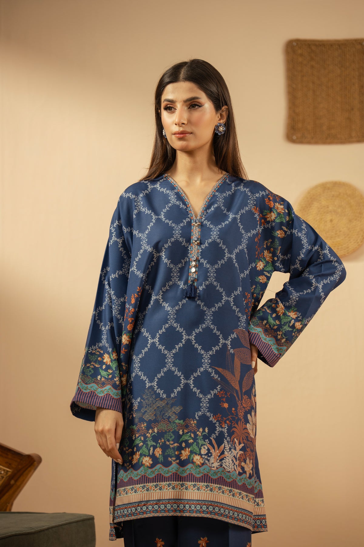 Casual stitched 2-piece blue poly cambric suit highlighted by sharp contemporary patterns