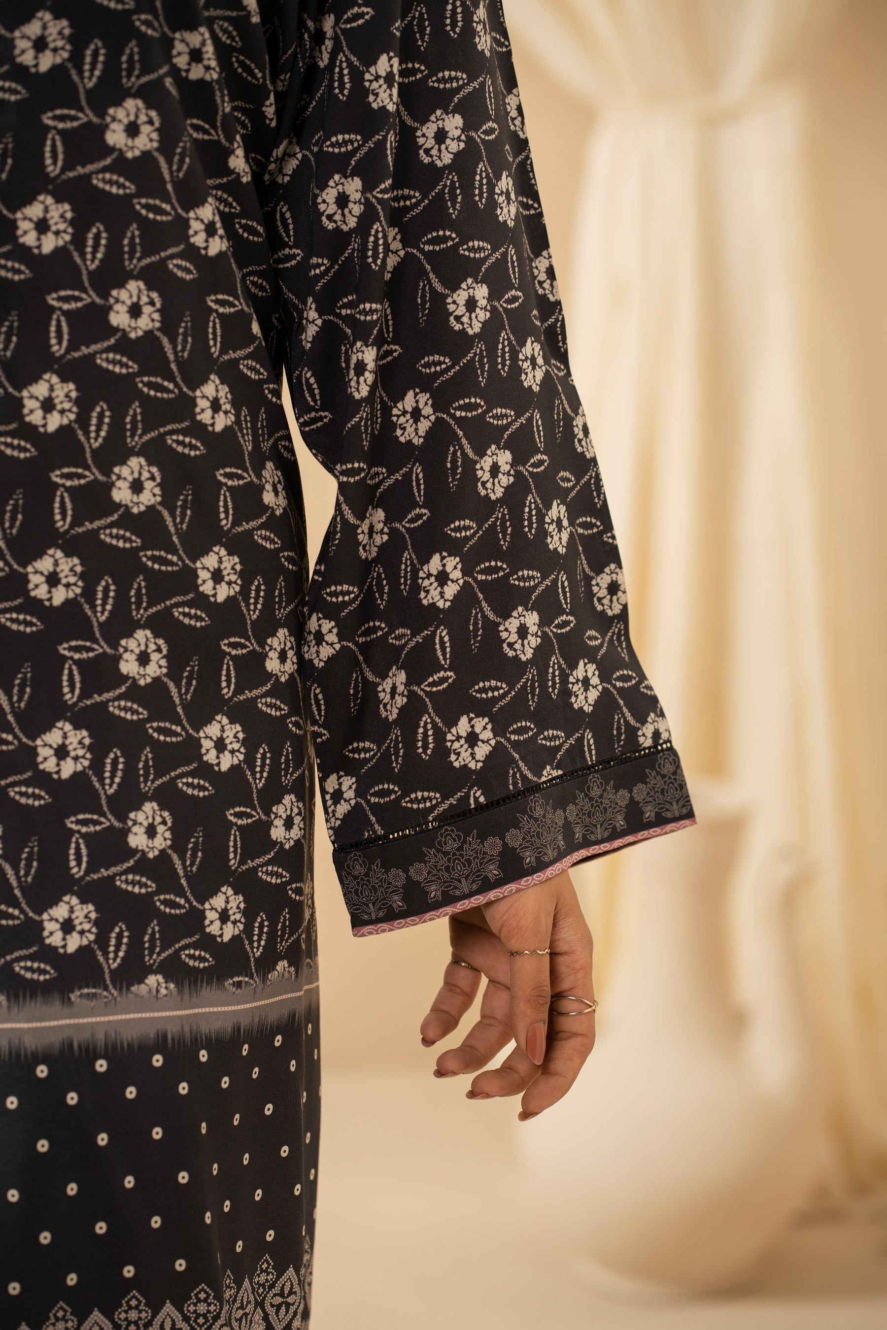 Casual stitched black linen top with modern abstract print patterns and a comfortable fit