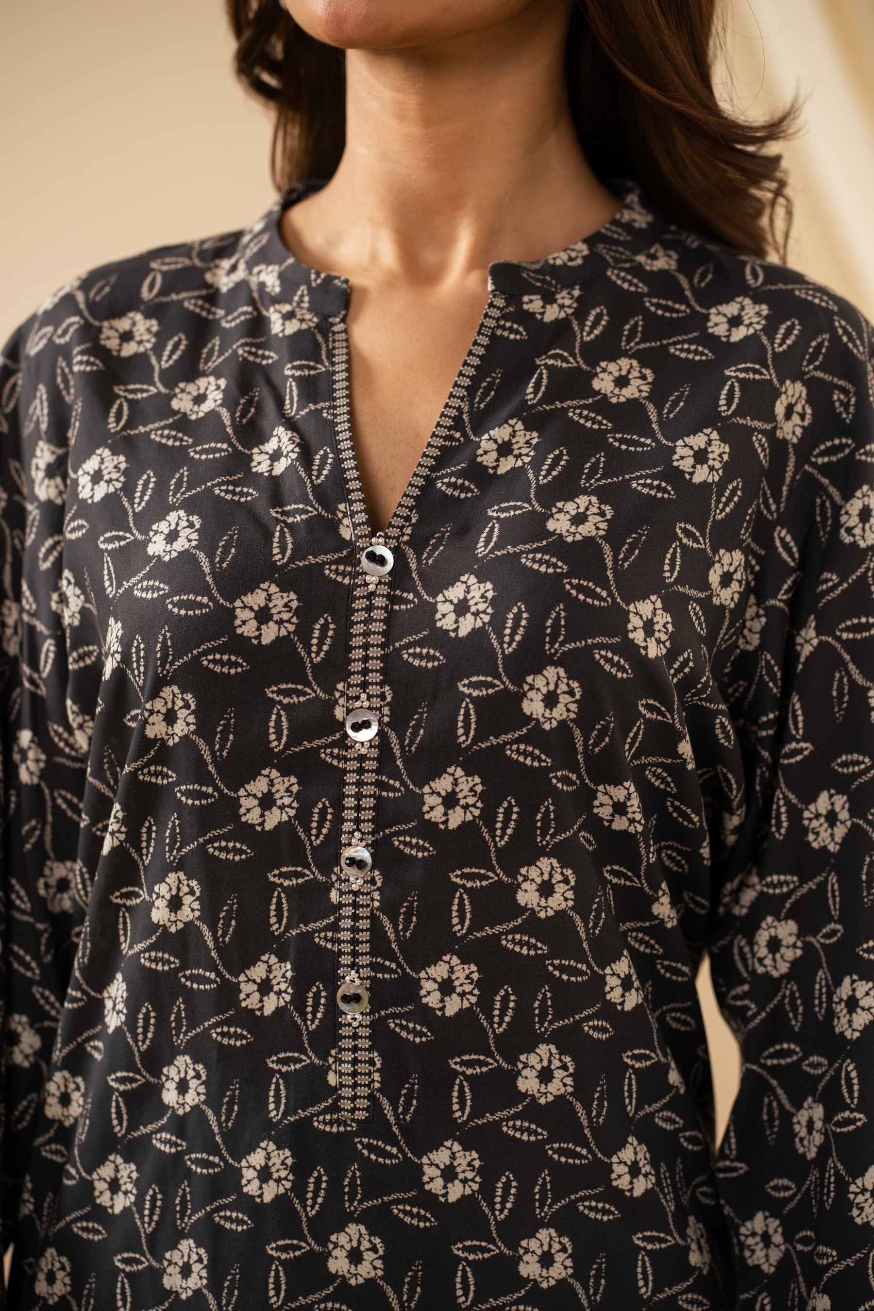 Casual stitched black linen top with modern abstract print patterns and a comfortable fit