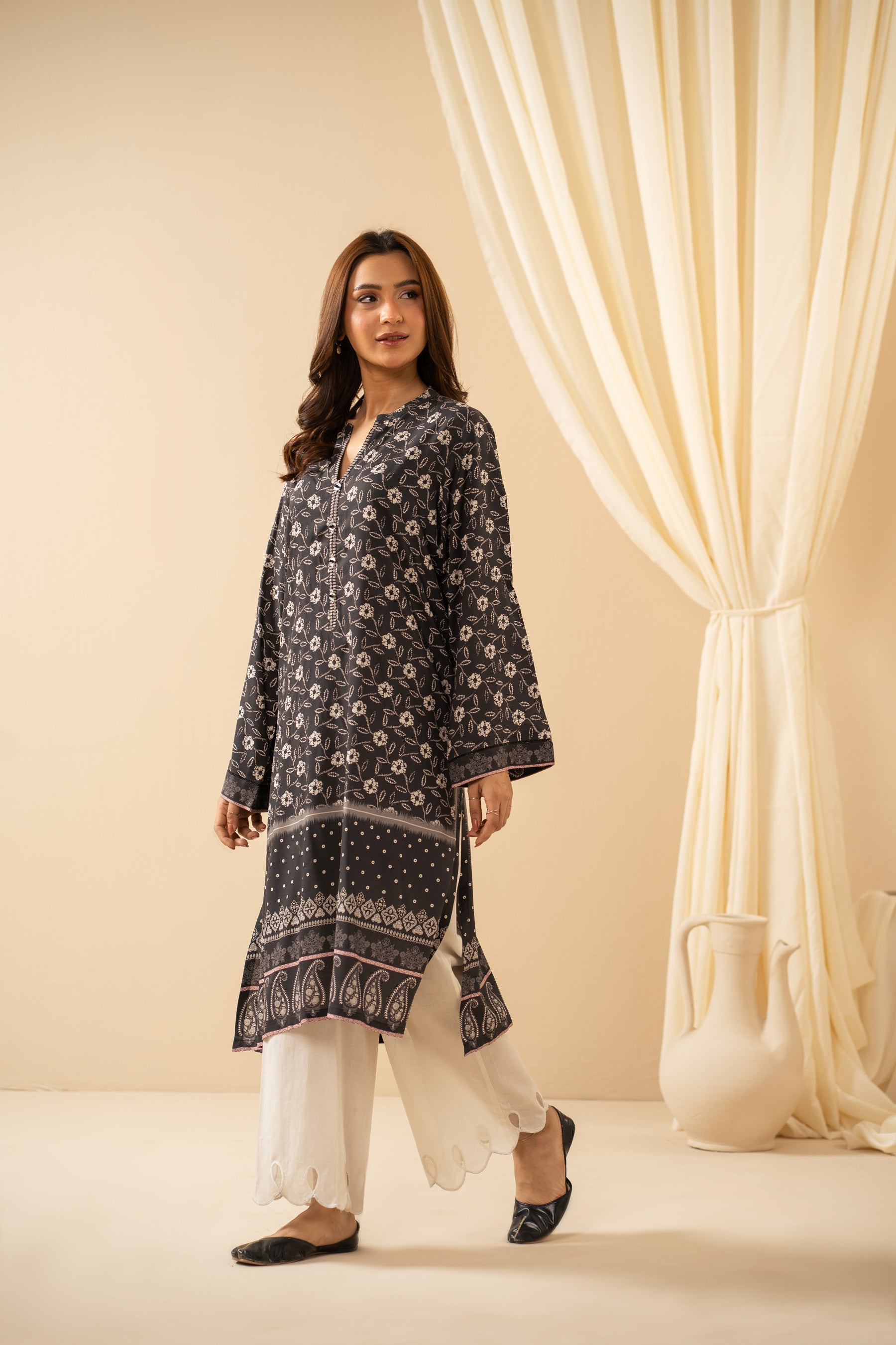 Casual stitched black linen top with modern abstract print patterns and a comfortable fit