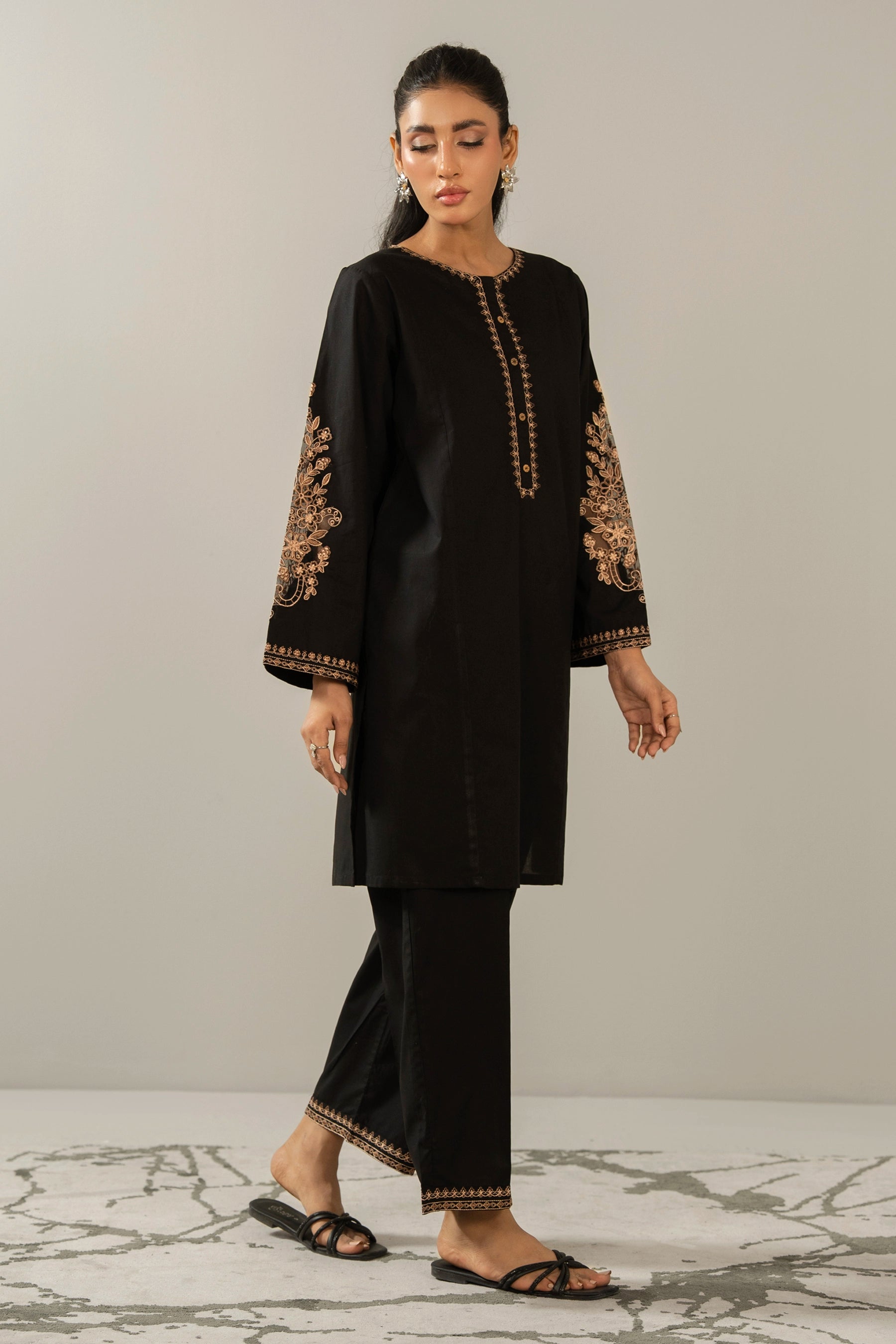 Elegant stitched 2-piece black cambric suit with intricate embroidery detail on the shirt paired with matching bottom trousers