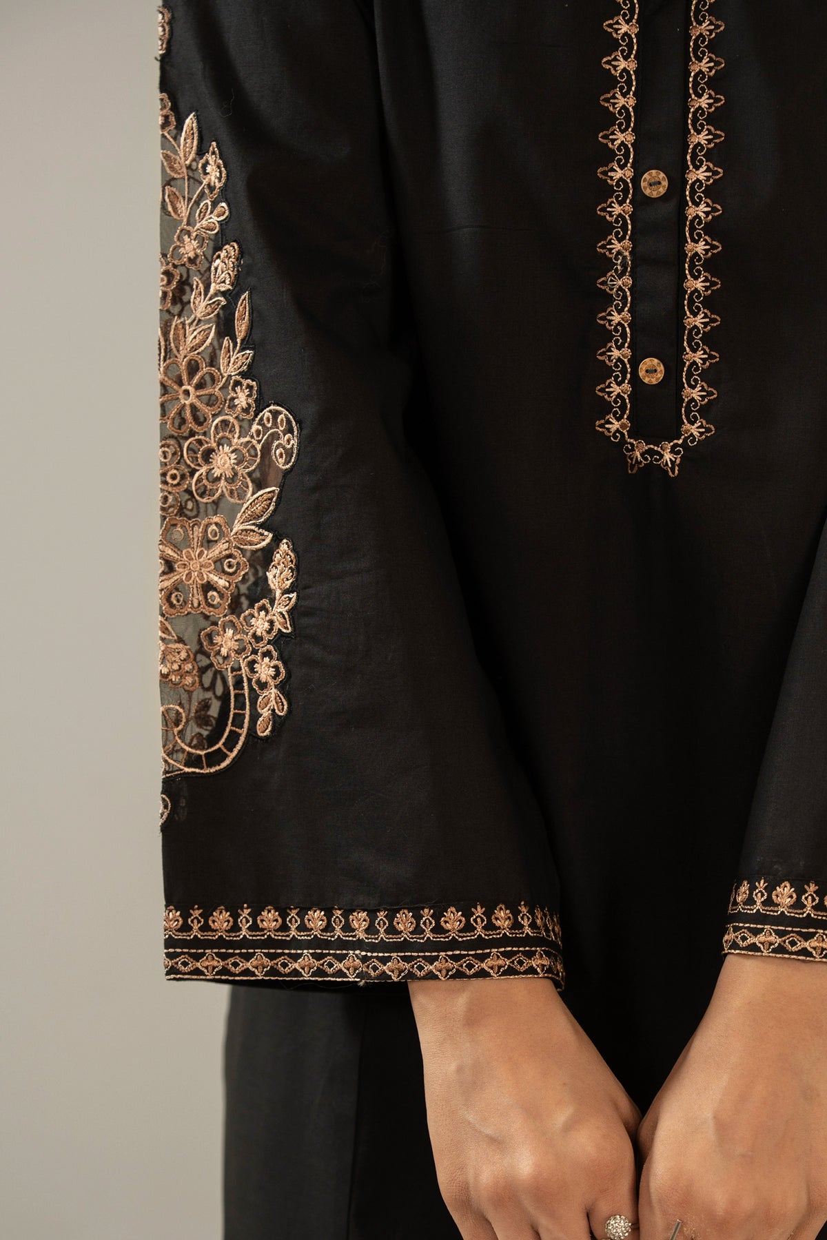 Elegant stitched 2-piece black cambric suit with intricate embroidery detail on the shirt paired with matching bottom trousers
