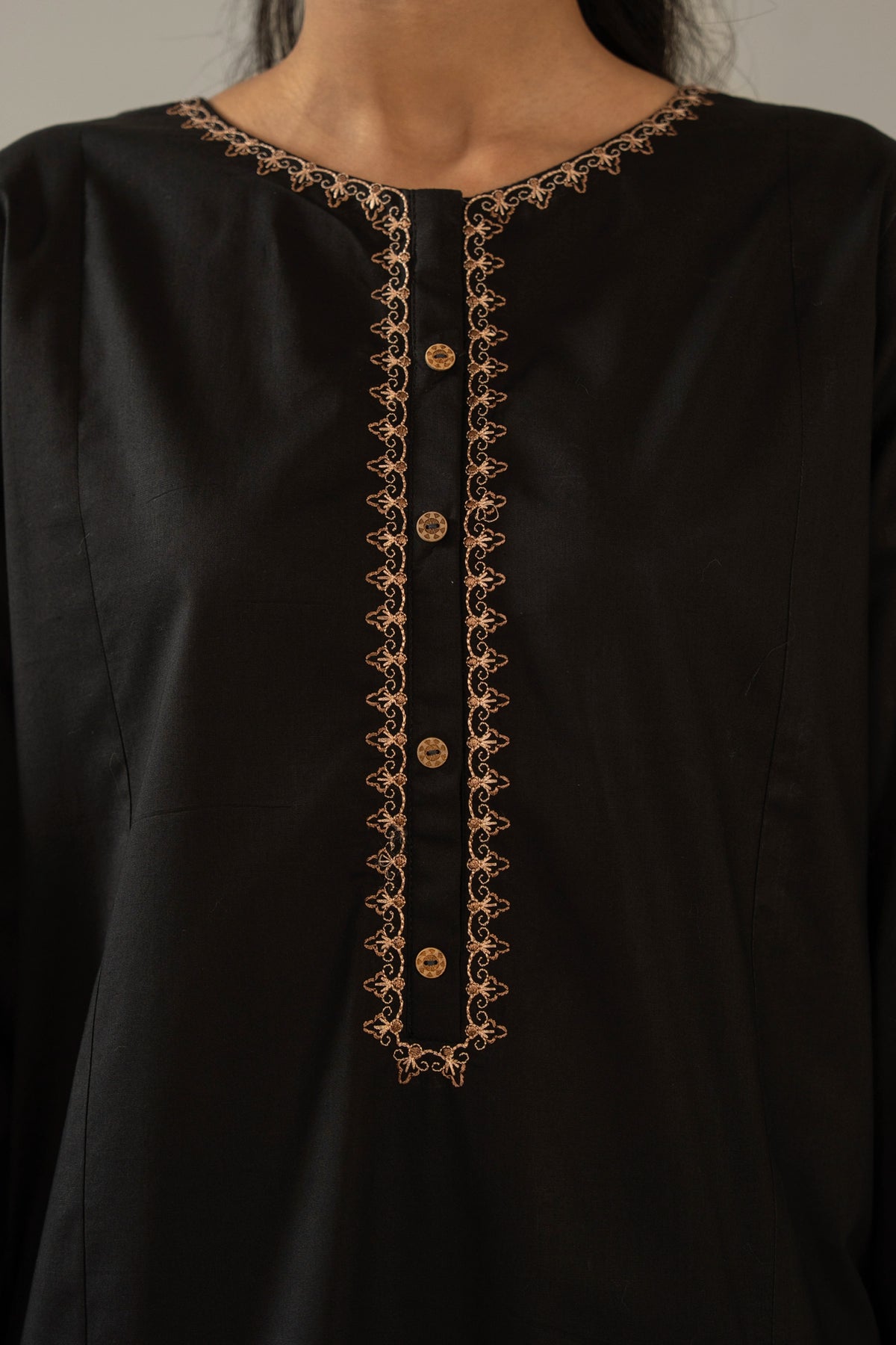 Elegant stitched 2-piece black cambric suit with intricate embroidery detail on the shirt paired with matching bottom trousers