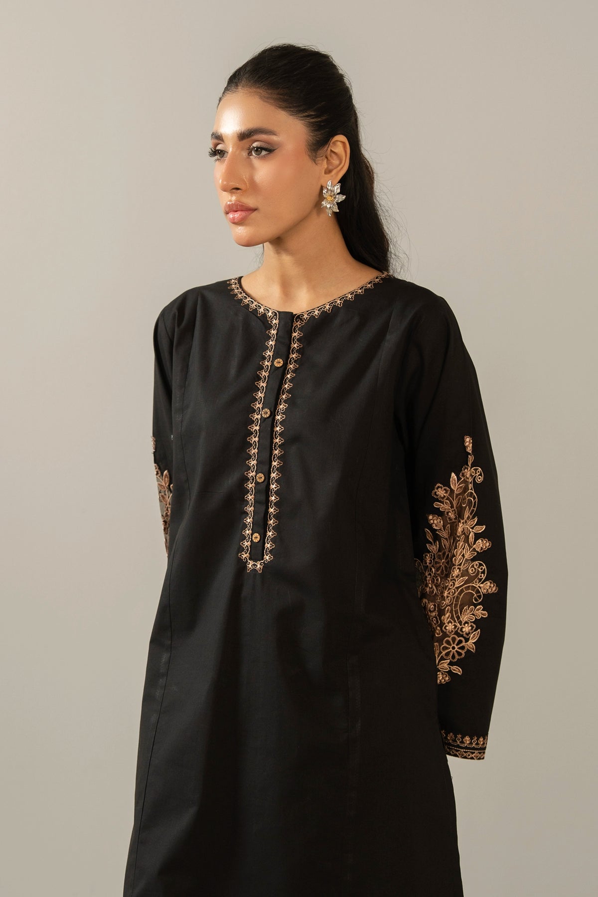 Elegant stitched 2-piece black cambric suit with intricate embroidery detail on the shirt paired with matching bottom trousers
