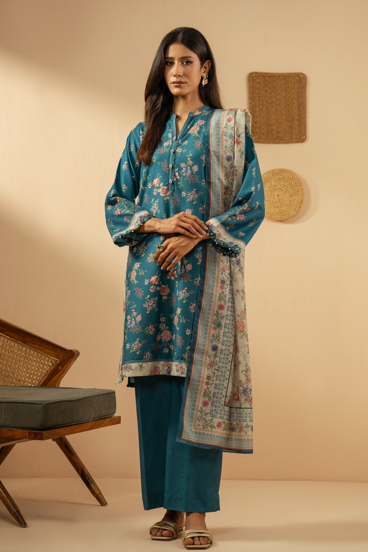 Elegant stitched 3-piece teal poly cambric suit with rich print arrangements, including a printed dupatta and matching trousers