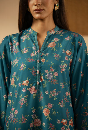 Elegant stitched 3-piece teal poly cambric suit with rich print arrangements, including a printed dupatta and matching trousers