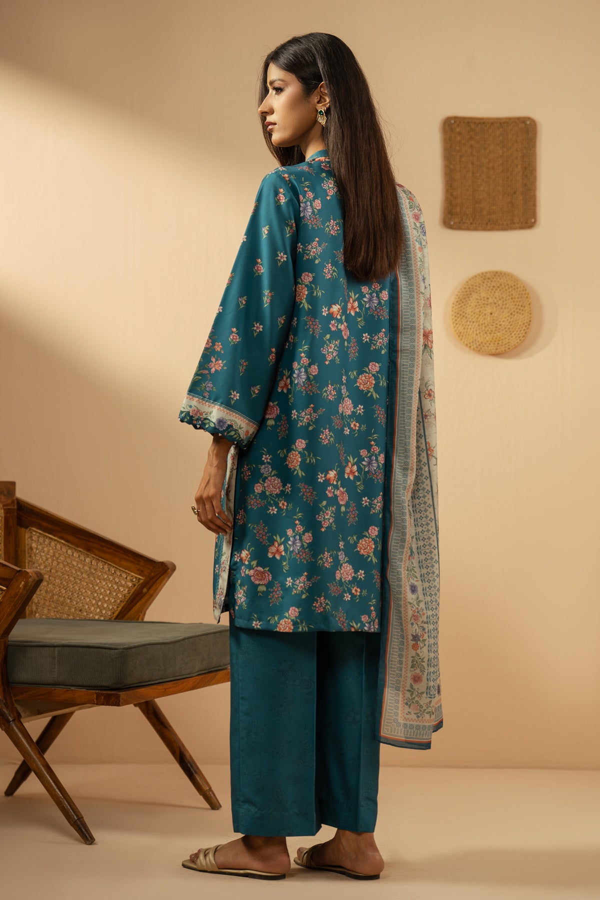 Elegant stitched 3-piece teal poly cambric suit with rich print arrangements, including a printed dupatta and matching trousers