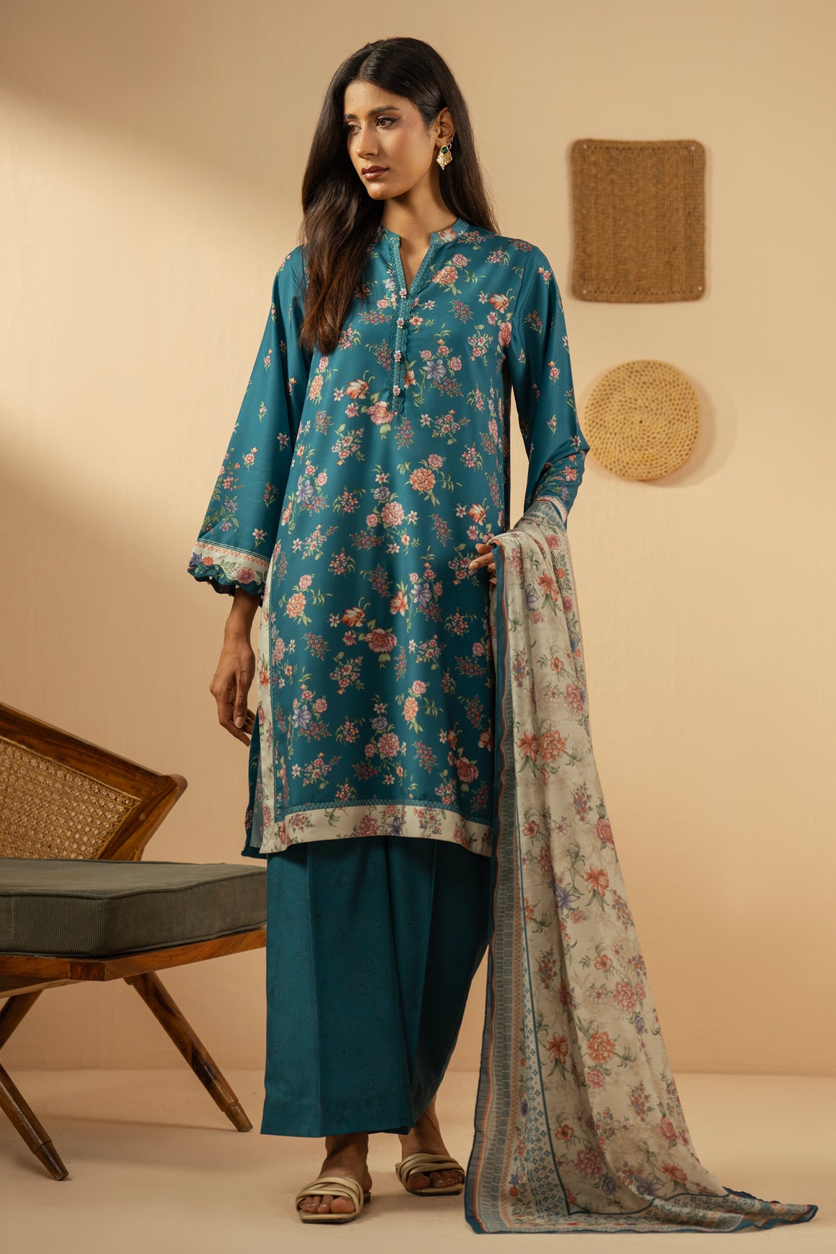 Elegant stitched 3-piece teal poly cambric suit with rich print arrangements, including a printed dupatta and matching trousers