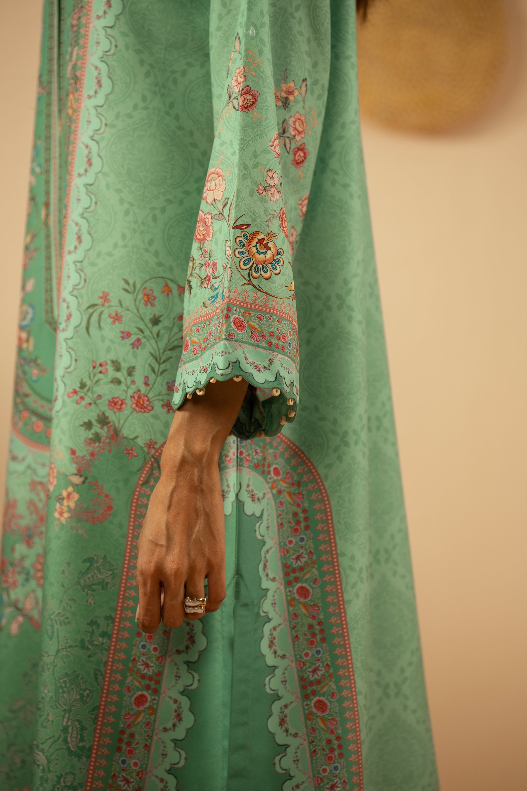 Refreshing sea green 3-piece stitched poly cambric suit with striking print designs, paired with a matching dupatta and trousers