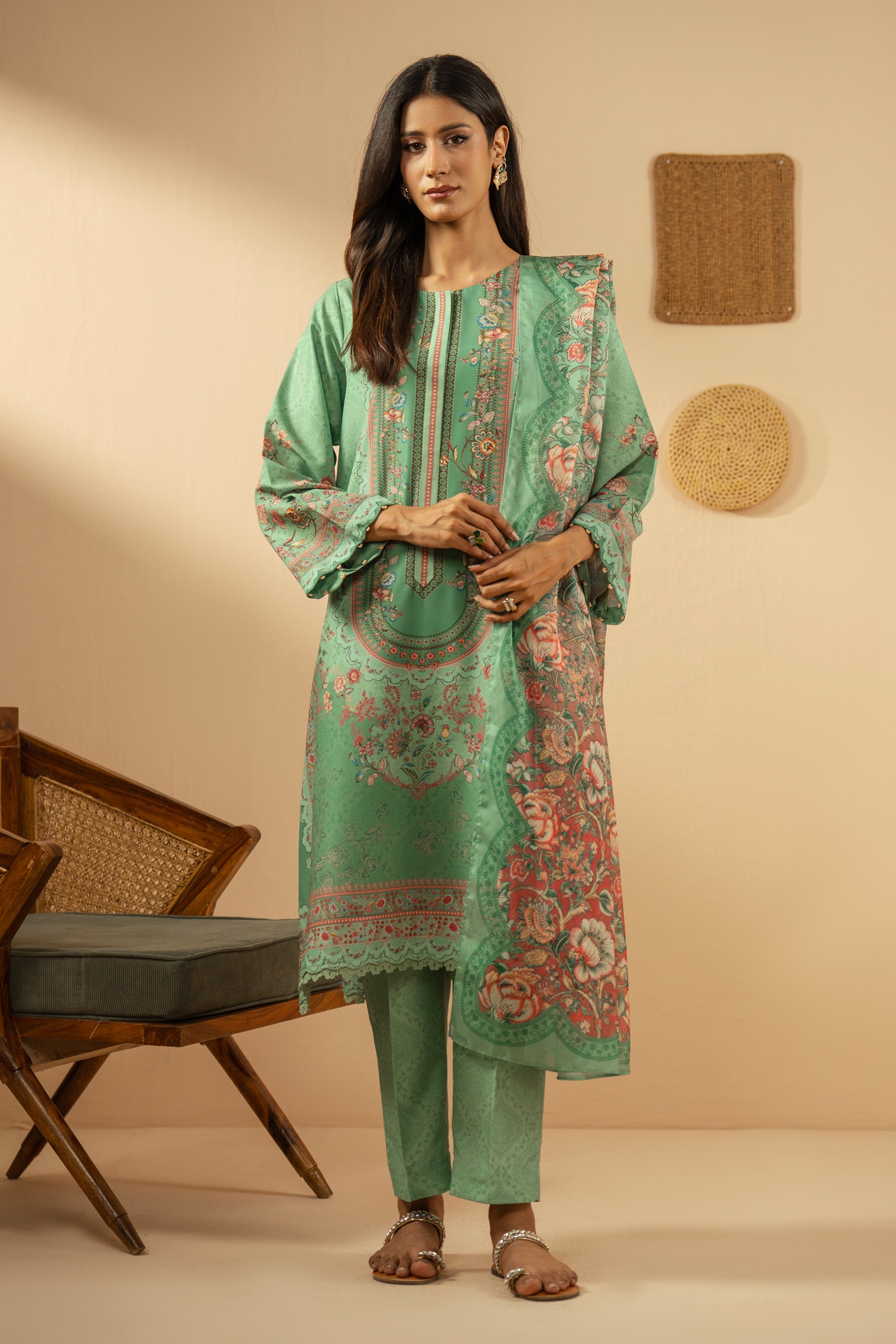 Refreshing sea green 3-piece stitched poly cambric suit with striking print designs, paired with a matching dupatta and trousers