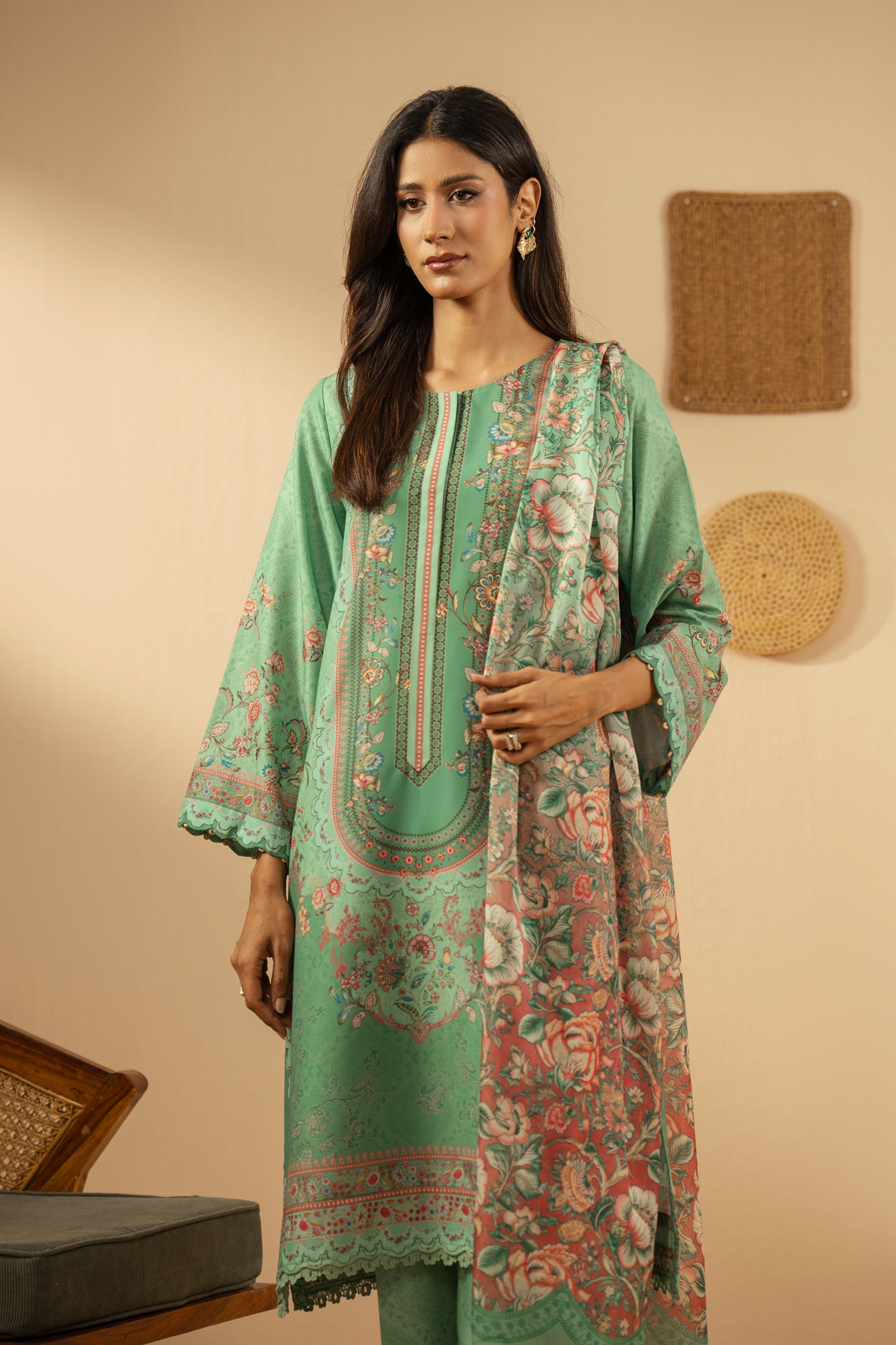 Refreshing sea green 3-piece stitched poly cambric suit with striking print designs, paired with a matching dupatta and trousers