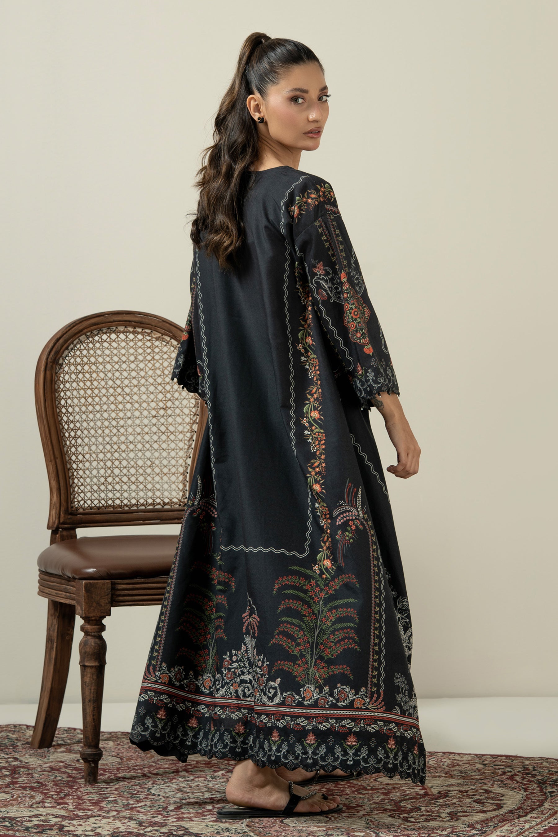 Sleek black stitched 1-piece poly cambric top decorated with contrasting minimalist graphic prints
