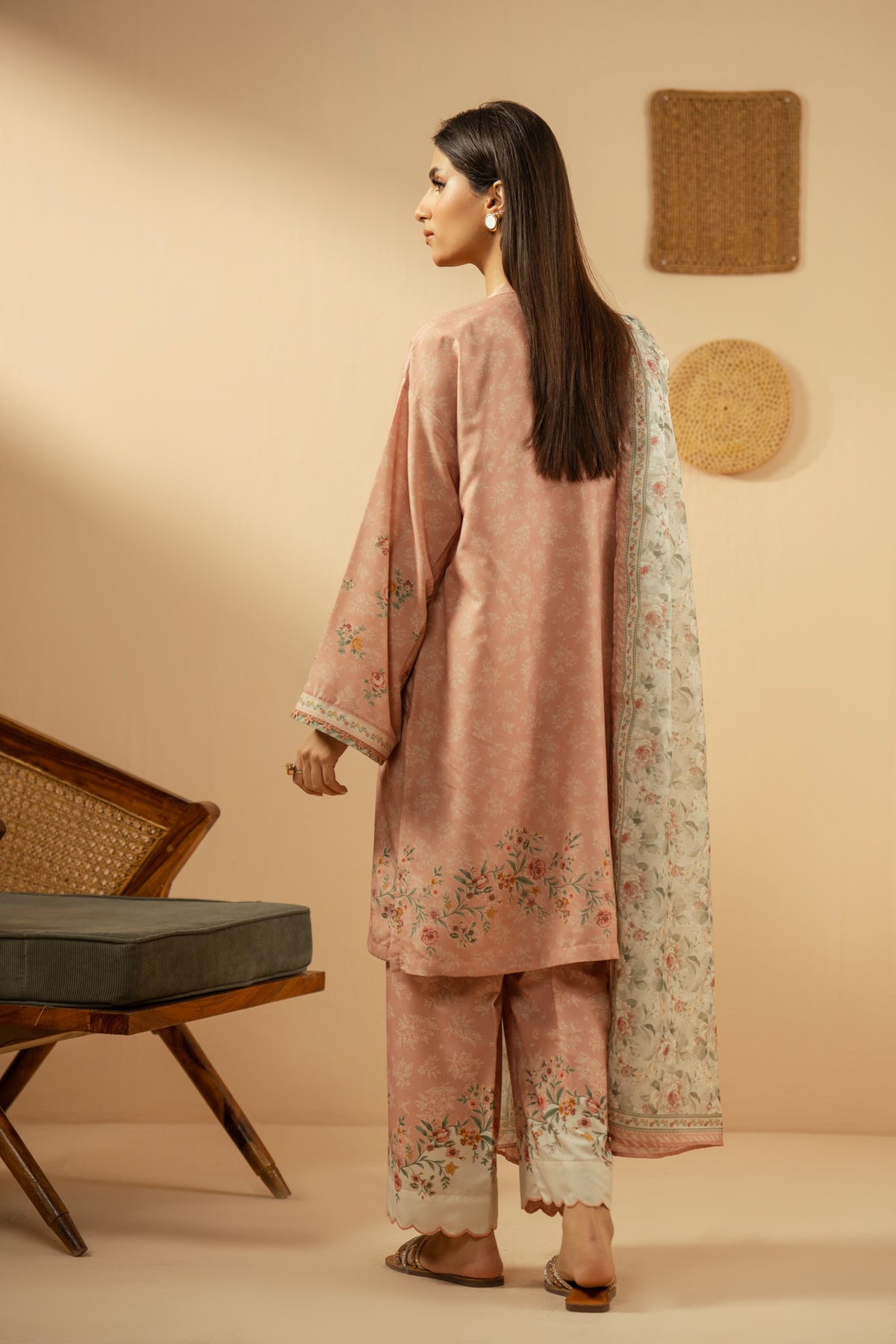 Soft peach stitched 3-piece poly cambric suit featuring intricate floral print layouts, matching dupatta, and trousers