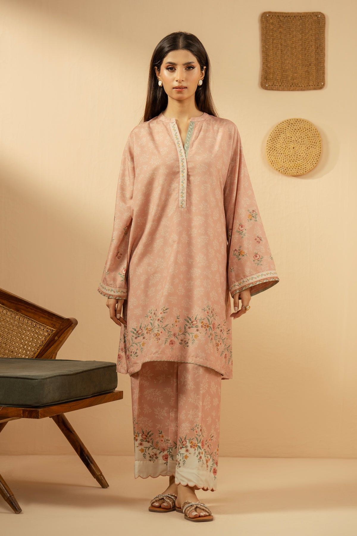 Soft peach stitched 3-piece poly cambric suit featuring intricate floral print layouts, matching dupatta, and trousers