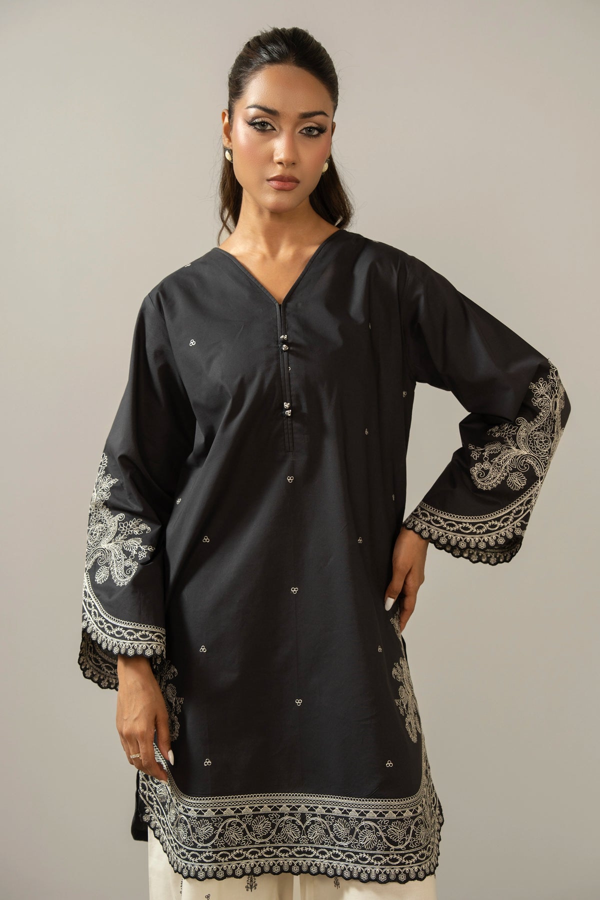Sophisticated black embroidered cambric 2-piece stitched suit showcasing elegant neckline detailing and matching trousers