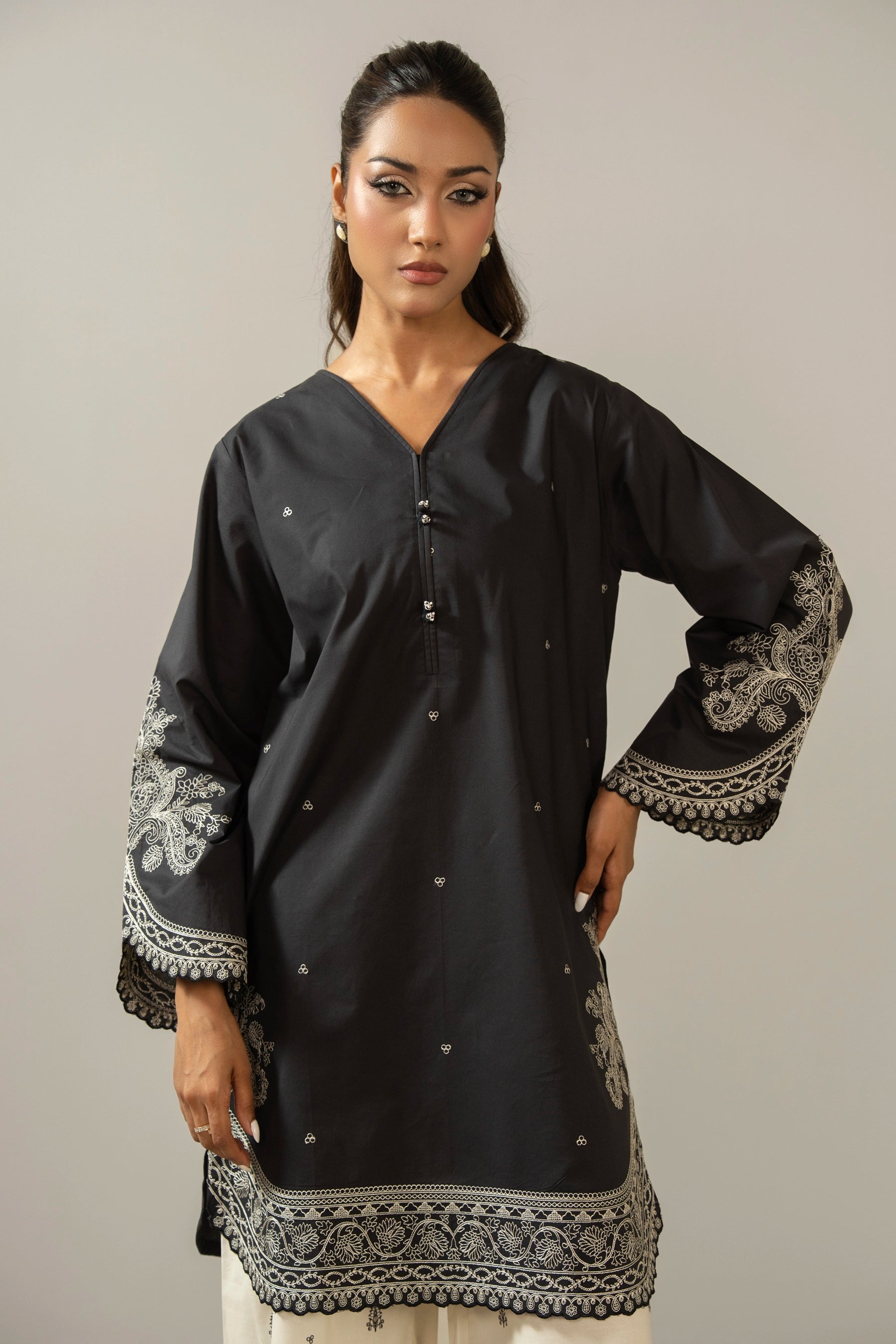 Sophisticated black embroidered cambric 2-piece stitched suit showcasing elegant neckline detailing and matching trousers