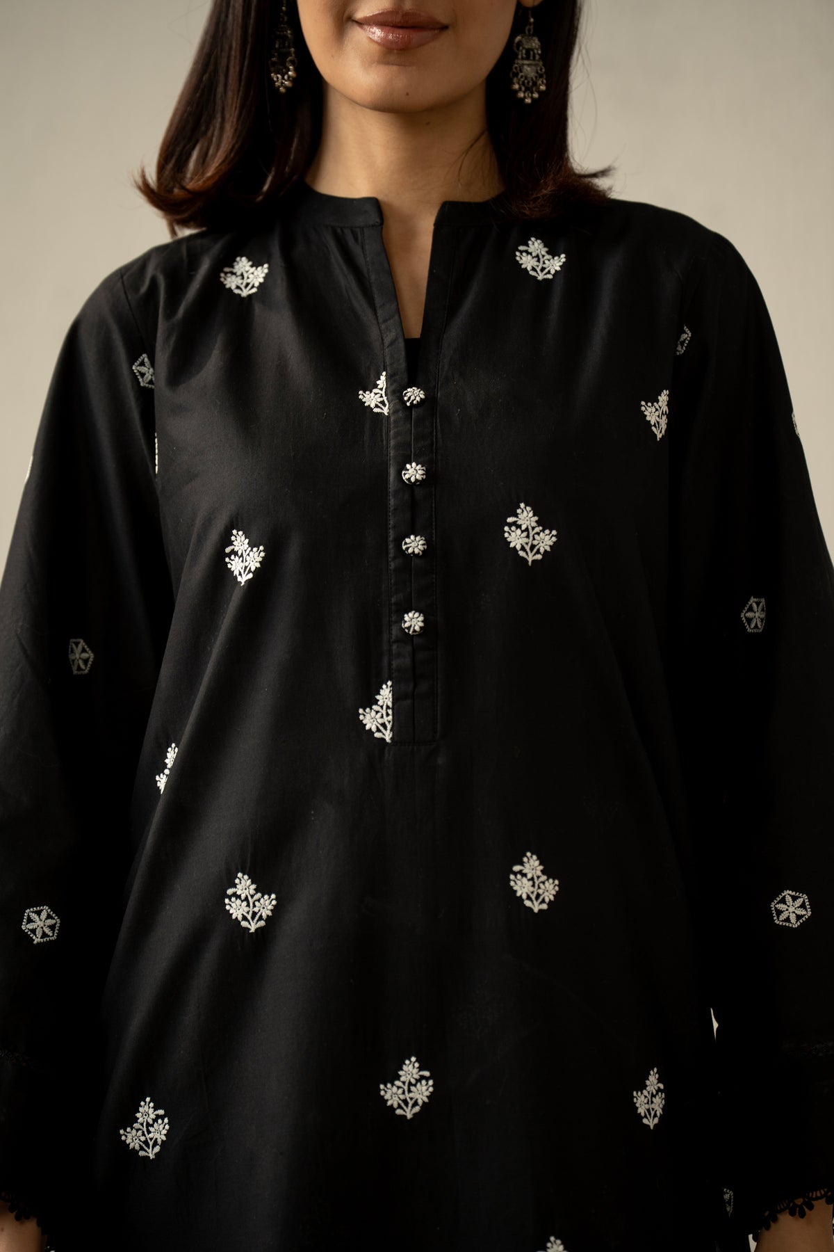 Stitched 2-piece black lawn suit featuring exquisite traditional Chikankari embroidery work on the shirt and trousers