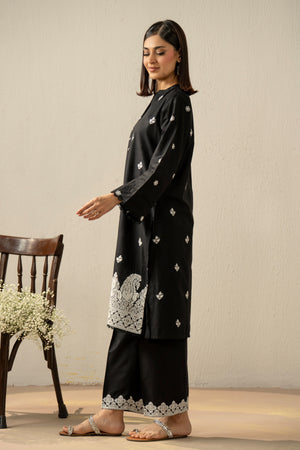 Stitched 2-piece black lawn suit featuring exquisite traditional Chikankari embroidery work on the shirt and trousers