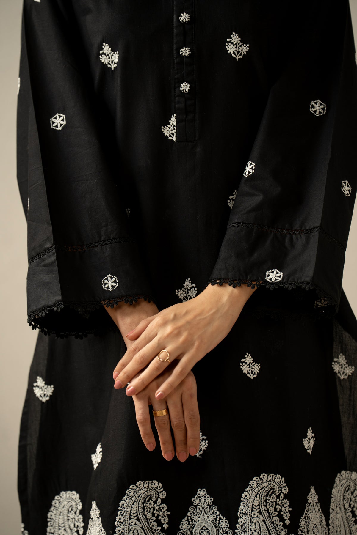 Stitched 2-piece black lawn suit featuring exquisite traditional Chikankari embroidery work on the shirt and trousers