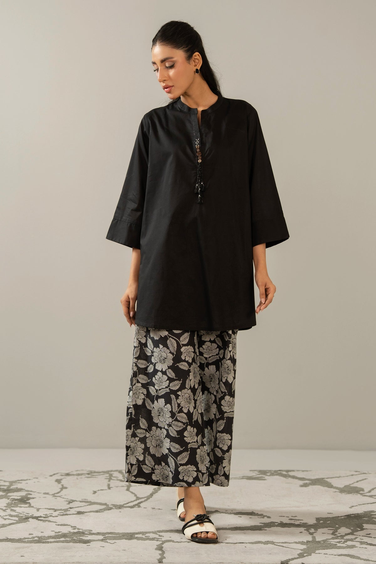 Stitched 2-piece black printed cambric suit with a matching printed shirt and straight trousers