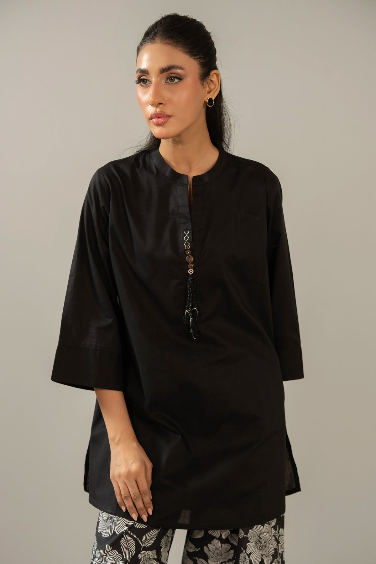 Stitched 2-piece black printed cambric suit with a matching printed shirt and straight trousers