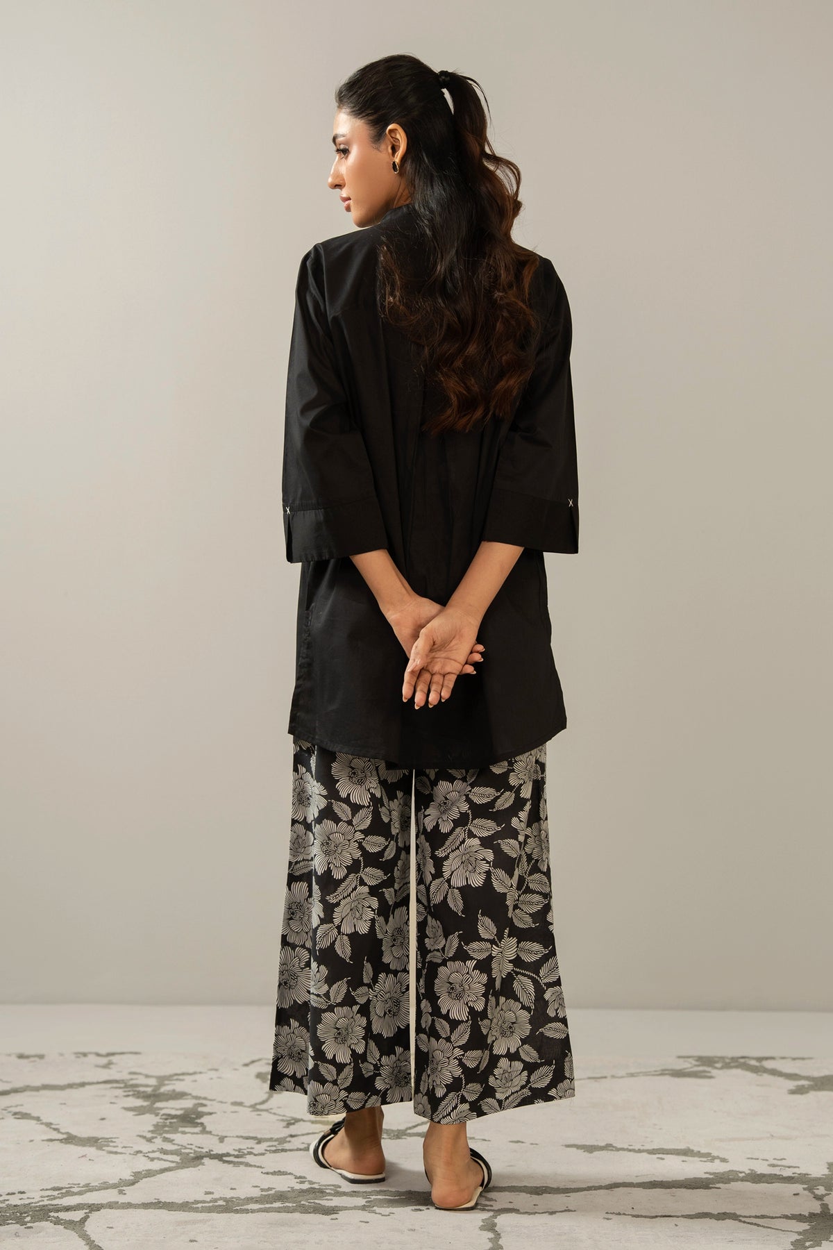 Stitched 2-piece black printed cambric suit with a matching printed shirt and straight trousers
