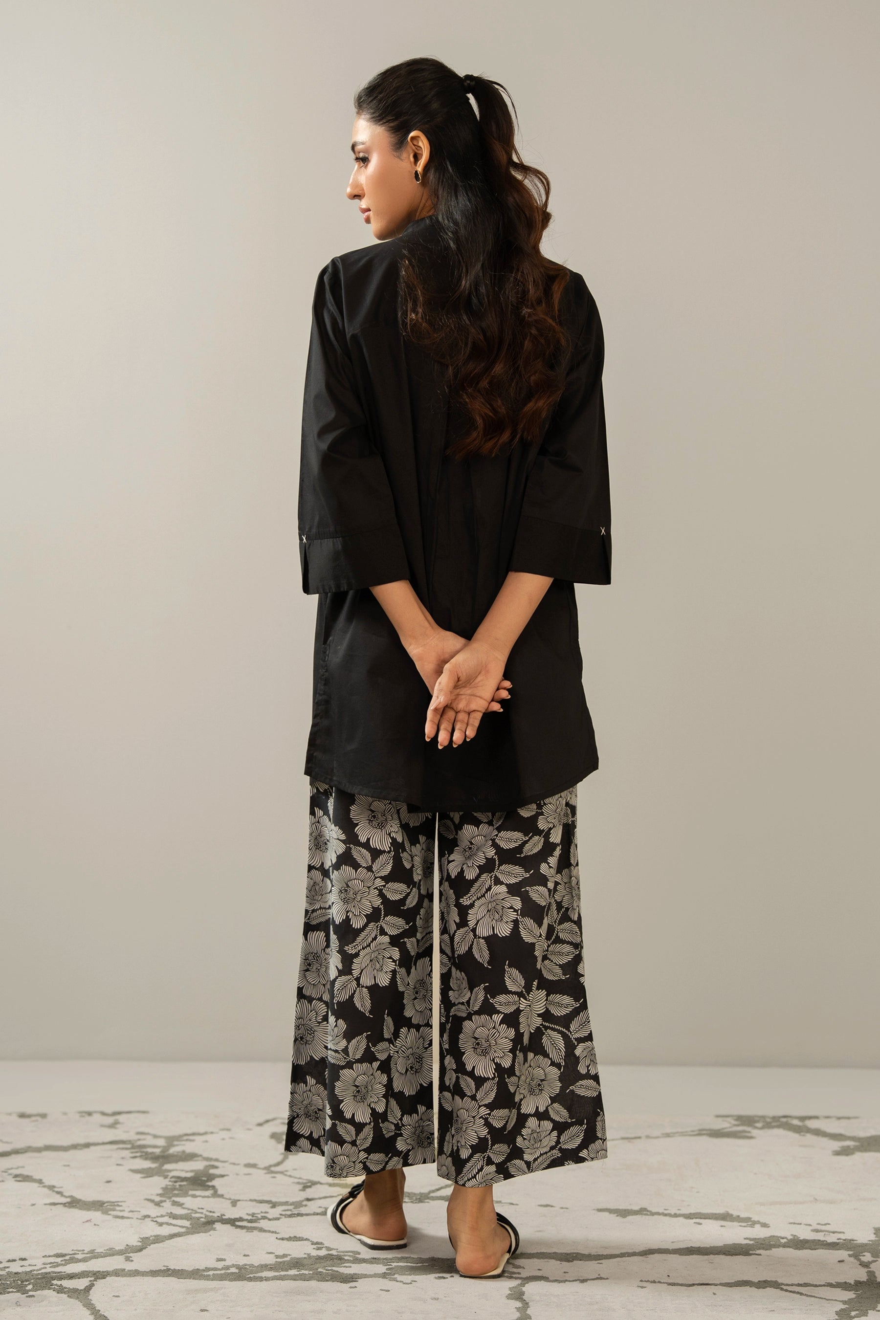 Stitched 2-piece black printed cambric suit with a matching printed shirt and straight trousers