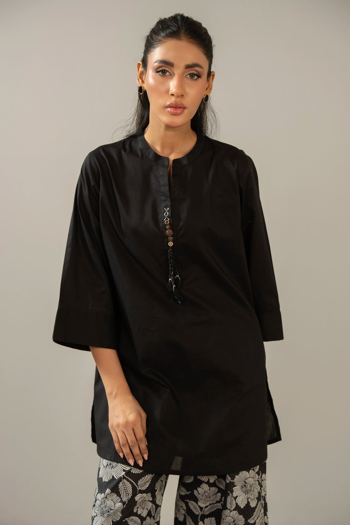 Stitched 2-piece black printed cambric suit with a matching printed shirt and straight trousers