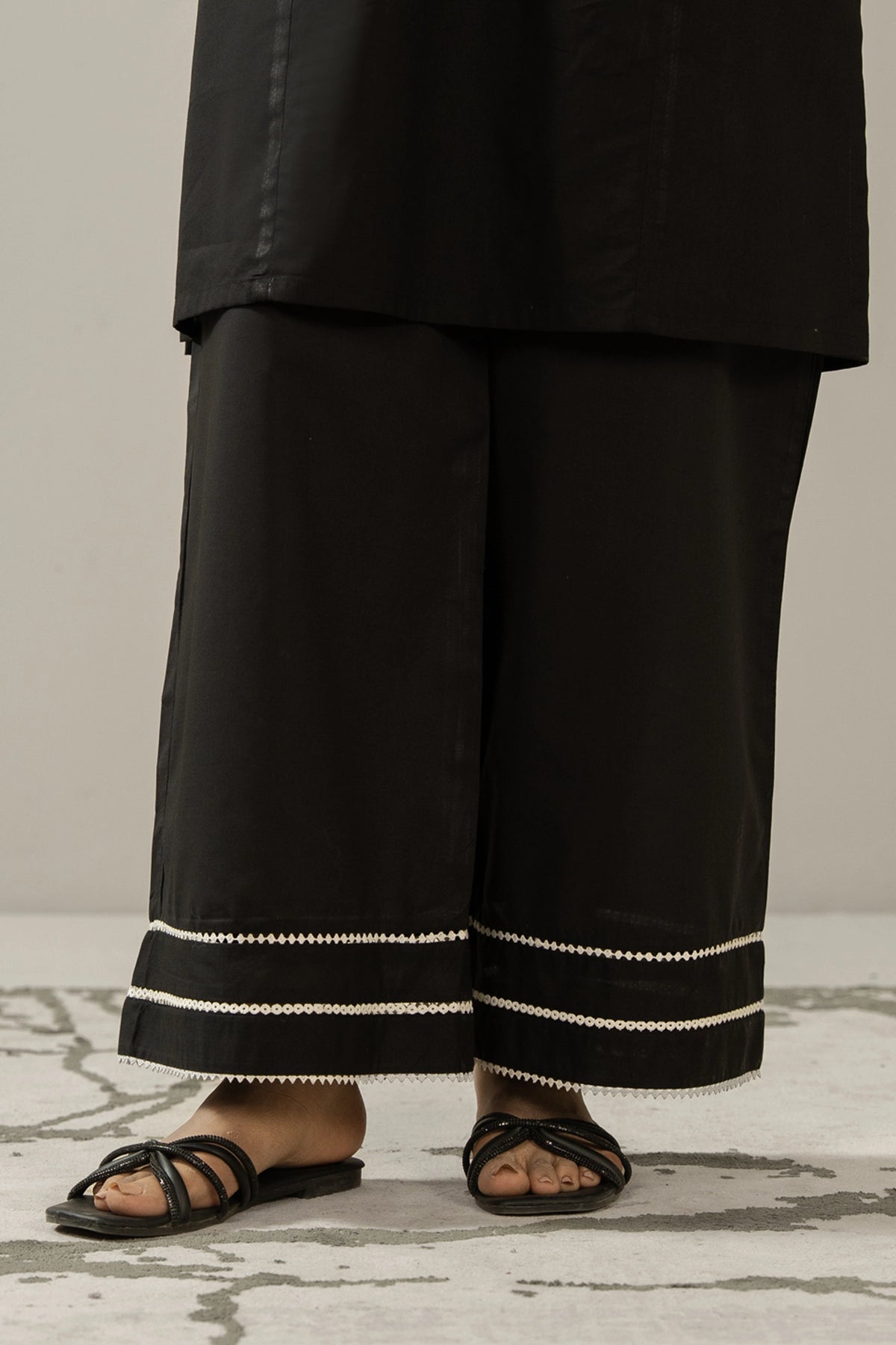 Wide-leg stylized black cambric culottes with unique stitching cuts and details