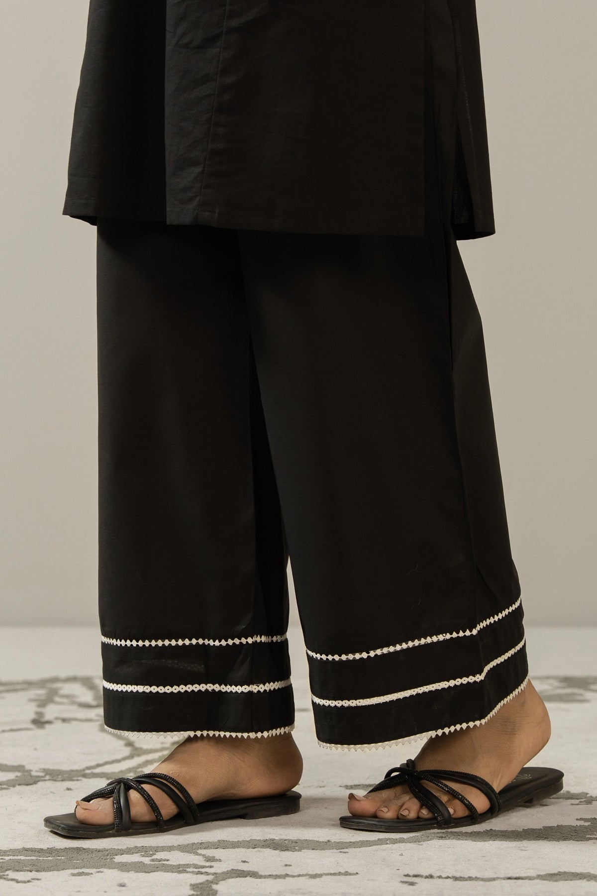 Wide-leg stylized black cambric culottes with unique stitching cuts and details