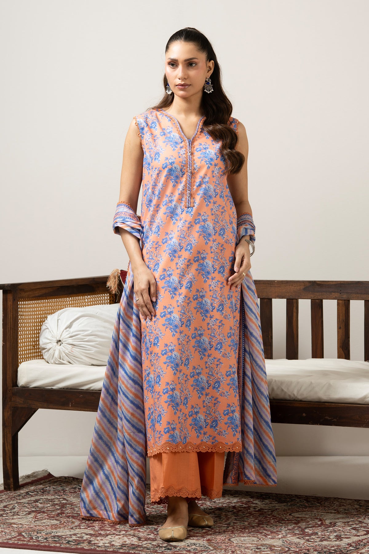 Bright orange printed lawn unstitched 3-piece suit with a premium, vibrant multi-colored dupatta border