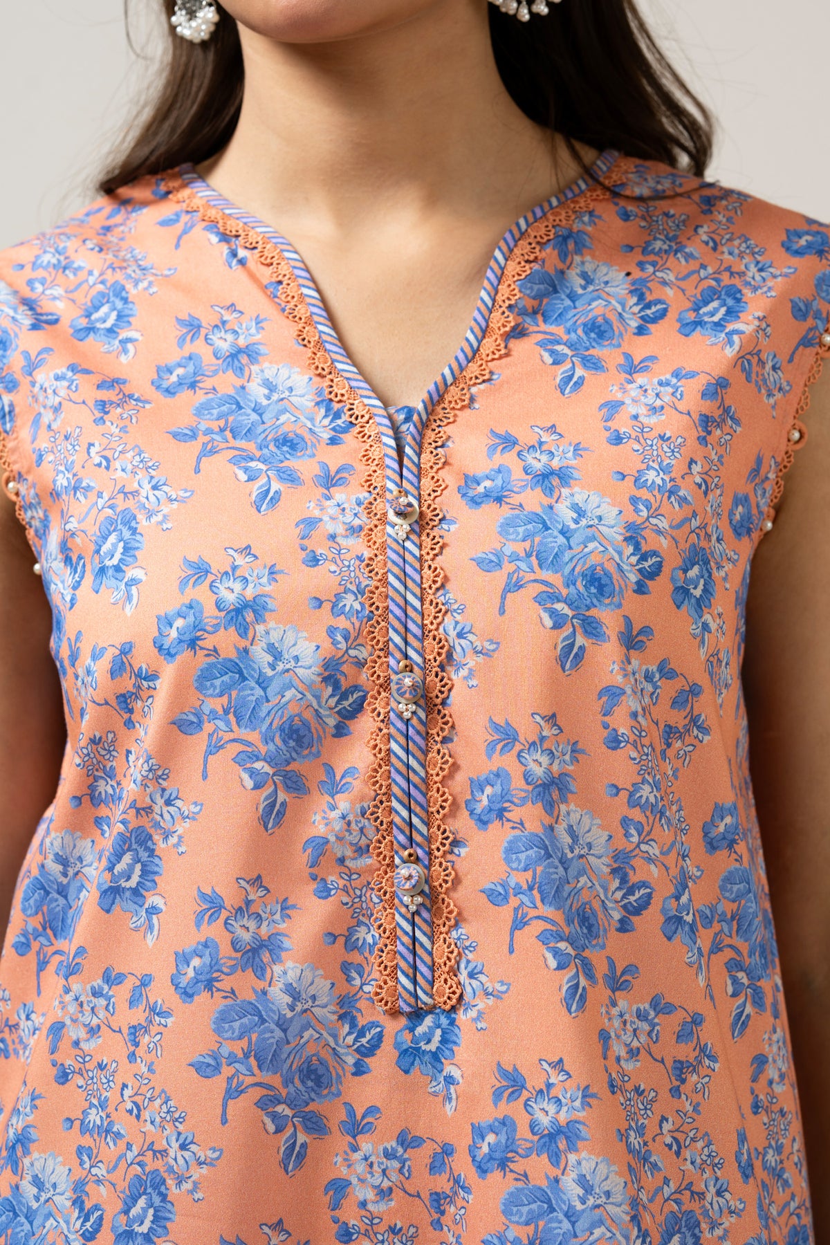 Bright orange printed lawn unstitched 3-piece suit with a premium, vibrant multi-colored dupatta border