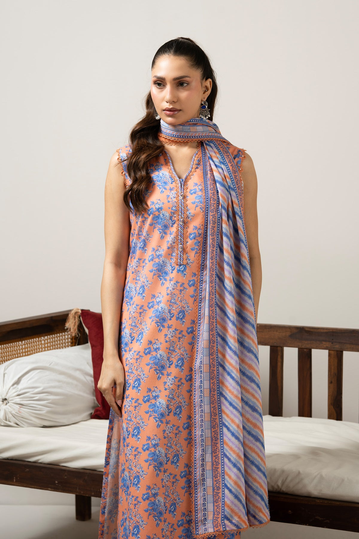 Bright orange printed lawn unstitched 3-piece suit with a premium, vibrant multi-colored dupatta border