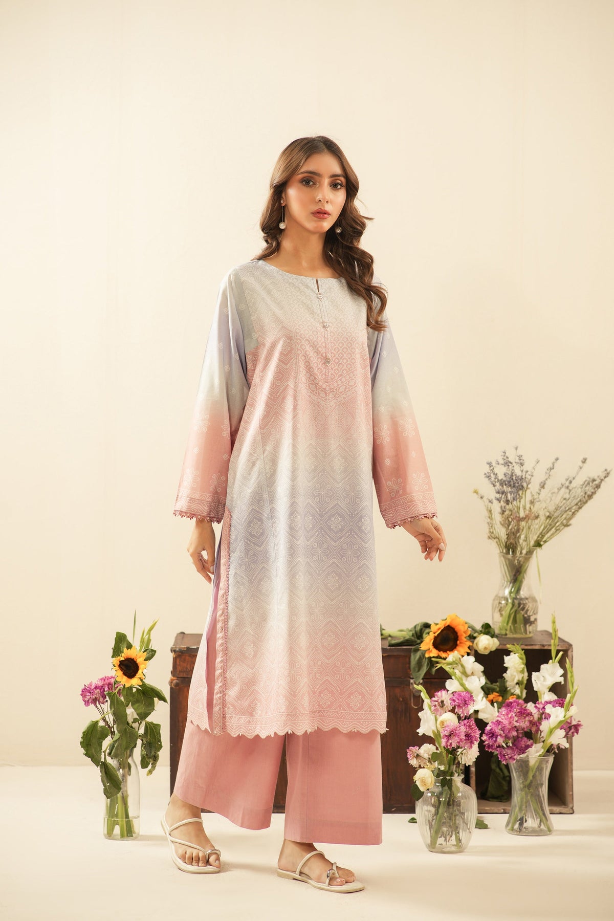 Contemporary multi-colored printed lawn unstitched 3-piece suit showing dynamic and artistic pattern layouts