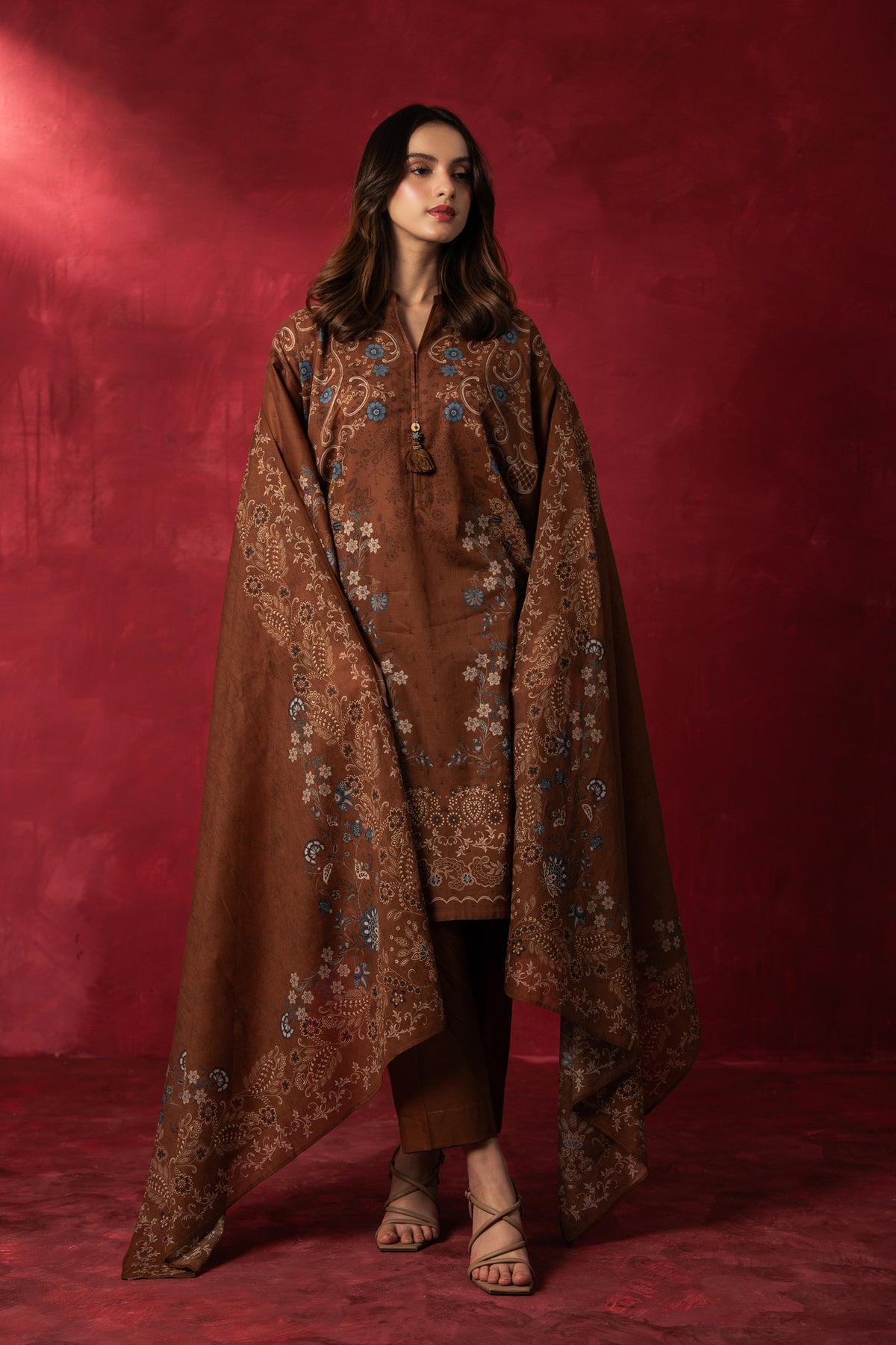 Earthy brown printed lawn unstitched 3-piece suit featuring high-contrast regular prints and fine lawn fabric finish