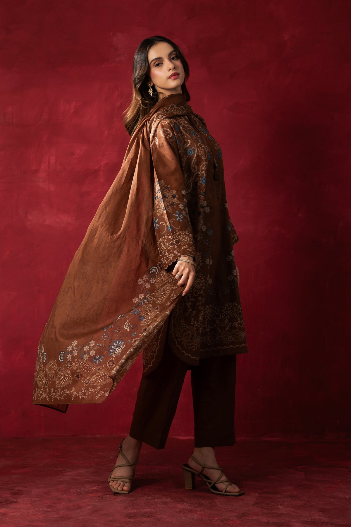 Earthy brown printed lawn unstitched 3-piece suit featuring high-contrast regular prints and fine lawn fabric finish