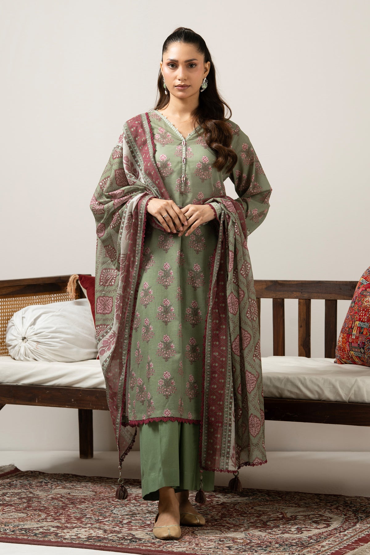 Emerald green 3-piece unstitched printed lawn suite showcasing clean structural geometric designs