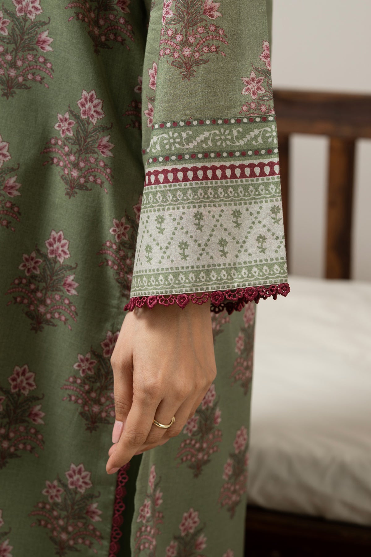 Emerald green 3-piece unstitched printed lawn suite showcasing clean structural geometric designs