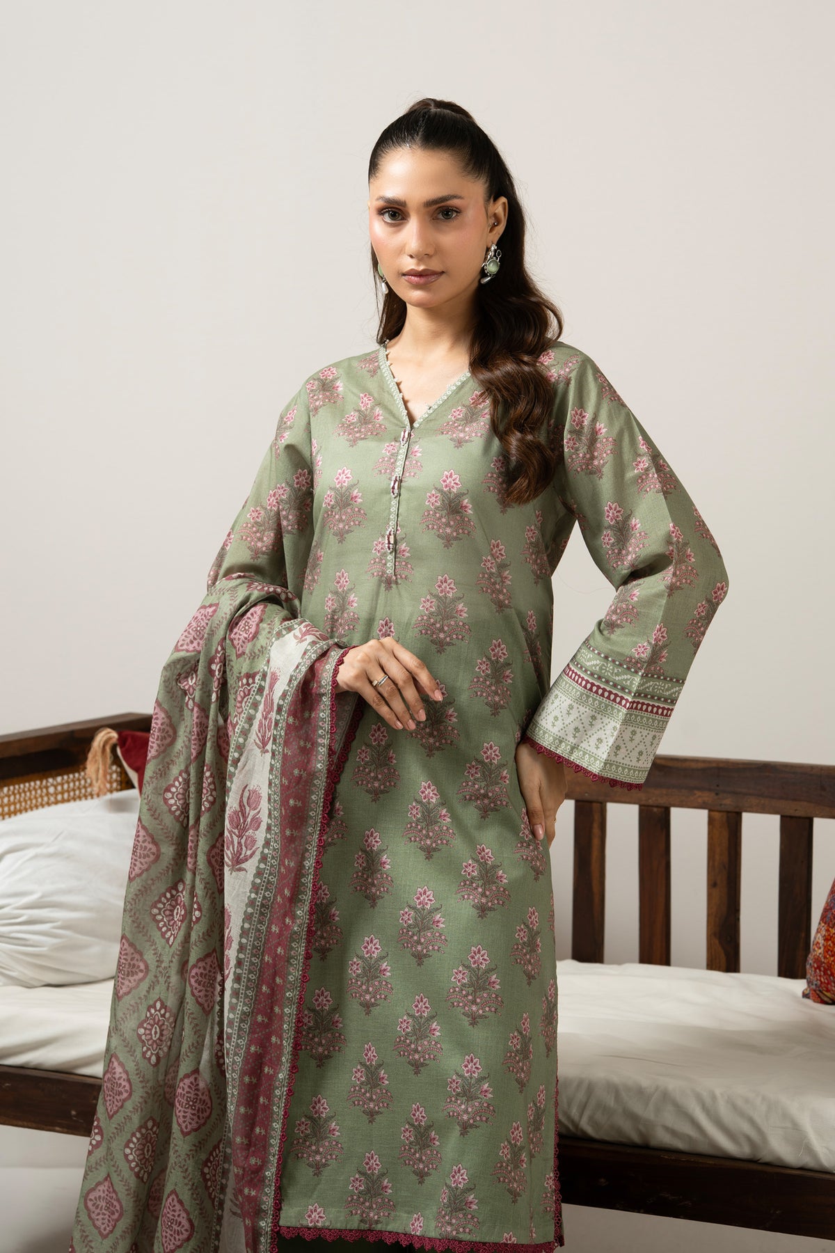 Emerald green 3-piece unstitched printed lawn suite showcasing clean structural geometric designs