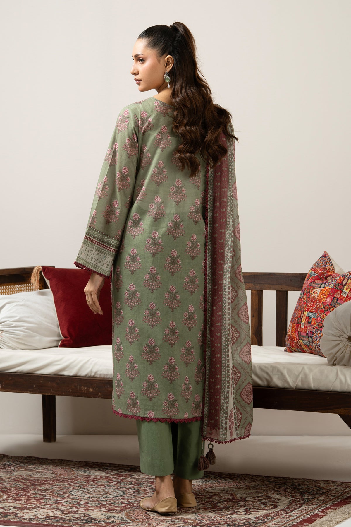 Emerald green 3-piece unstitched printed lawn suite showcasing clean structural geometric designs