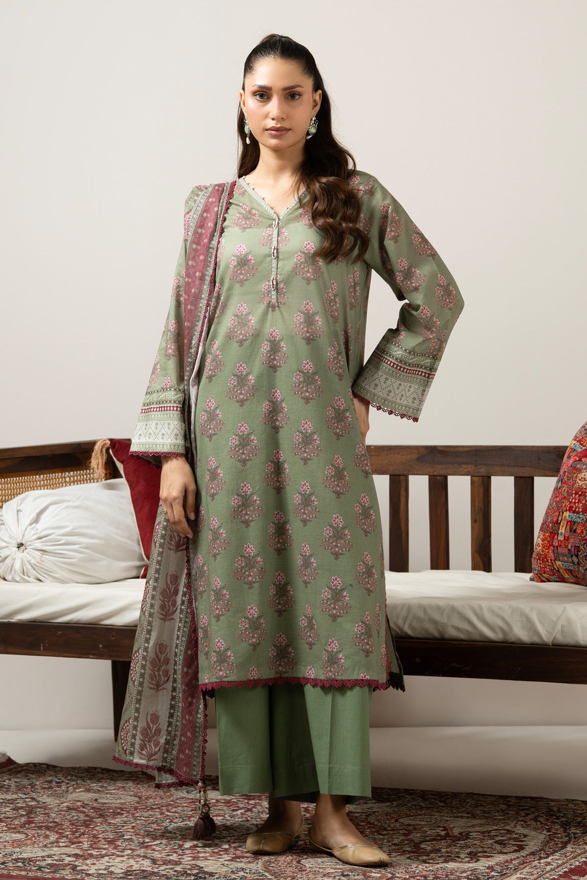 Emerald green 3-piece unstitched printed lawn suite showcasing clean structural geometric designs
