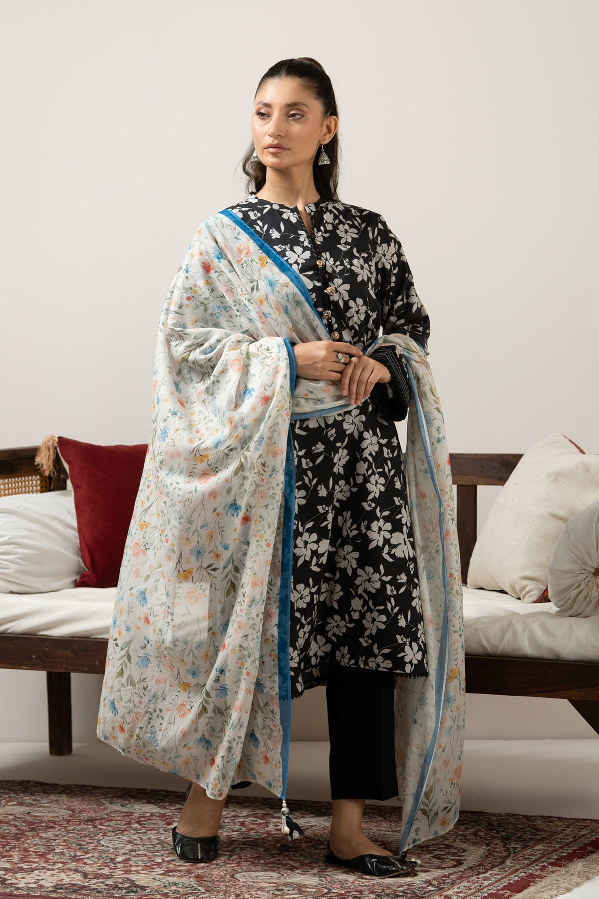 Luxury black unstitched 3-piece printed lawn dress material featuring detailed ethnic print layout lines